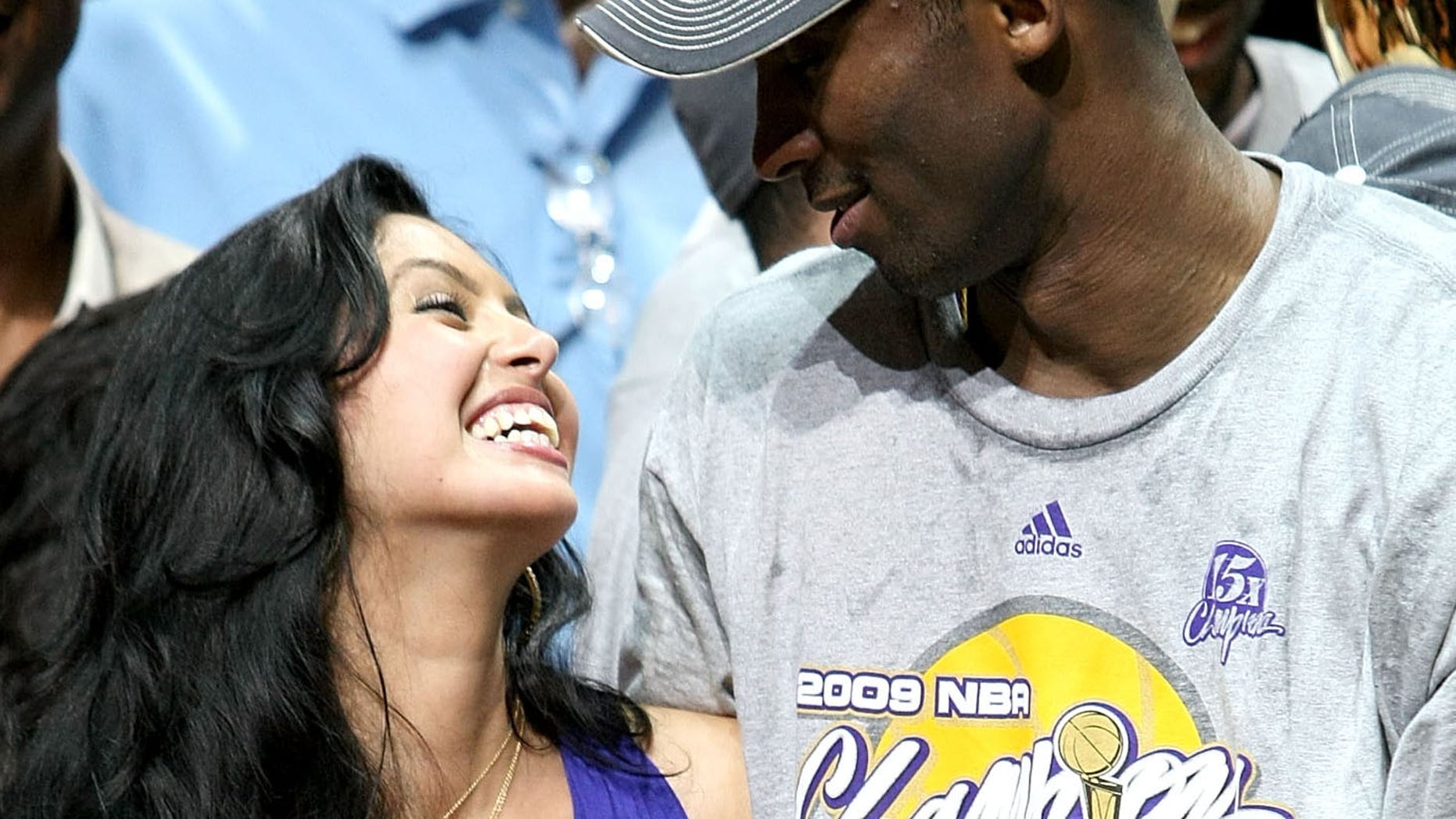 ORLANDO, FL - JUNE 14: Kobe Bryant #24 of the Los Angeles Lakers smiles with his wife Vanessa and his daughters Natalia and Gianna after the Lakers defeated the Orlando Magic 99-86 in Game Five of the 2009 NBA Finals on June 14, 2009 at Amway Arena in Orlando, Florida. NOTE TO USER: User expressly acknowledges and agrees that, by downloading and or using this photograph, User is consenting to the terms and conditions of the Getty Images License Agreement. (Photo by Elsa/Getty Images)