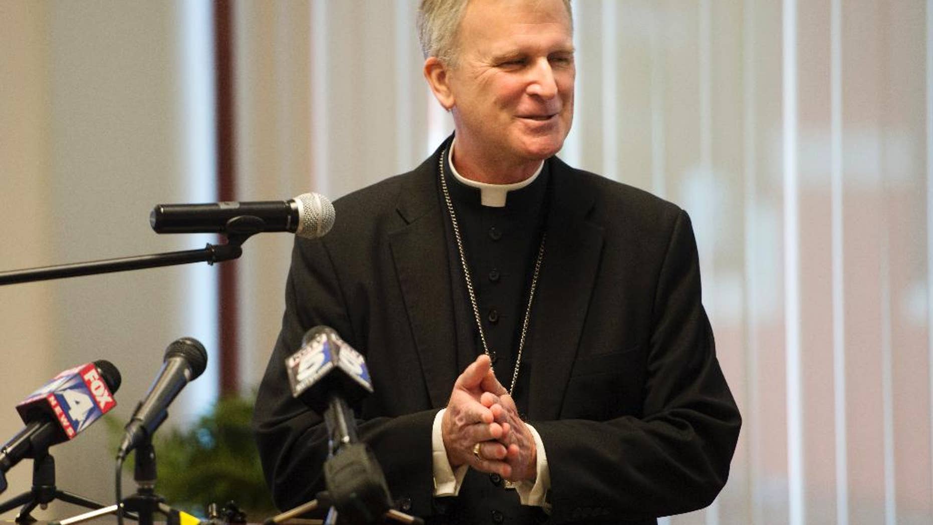 Bishop James V. Johnston Jr. talks to the media during a news conference on Tuesday, Sept. 15, 2015 in Kansas City, Mo. The diocese announced on its website Tuesday that Bishop James V. Johnston Jr. will take over from Archbishop Joseph Naumann, who has been overseeing the diocese since Bishop Robert Finn resigned in April. (Joe Ledford/The Kansas City Star via AP) MANDATORY CREDIT