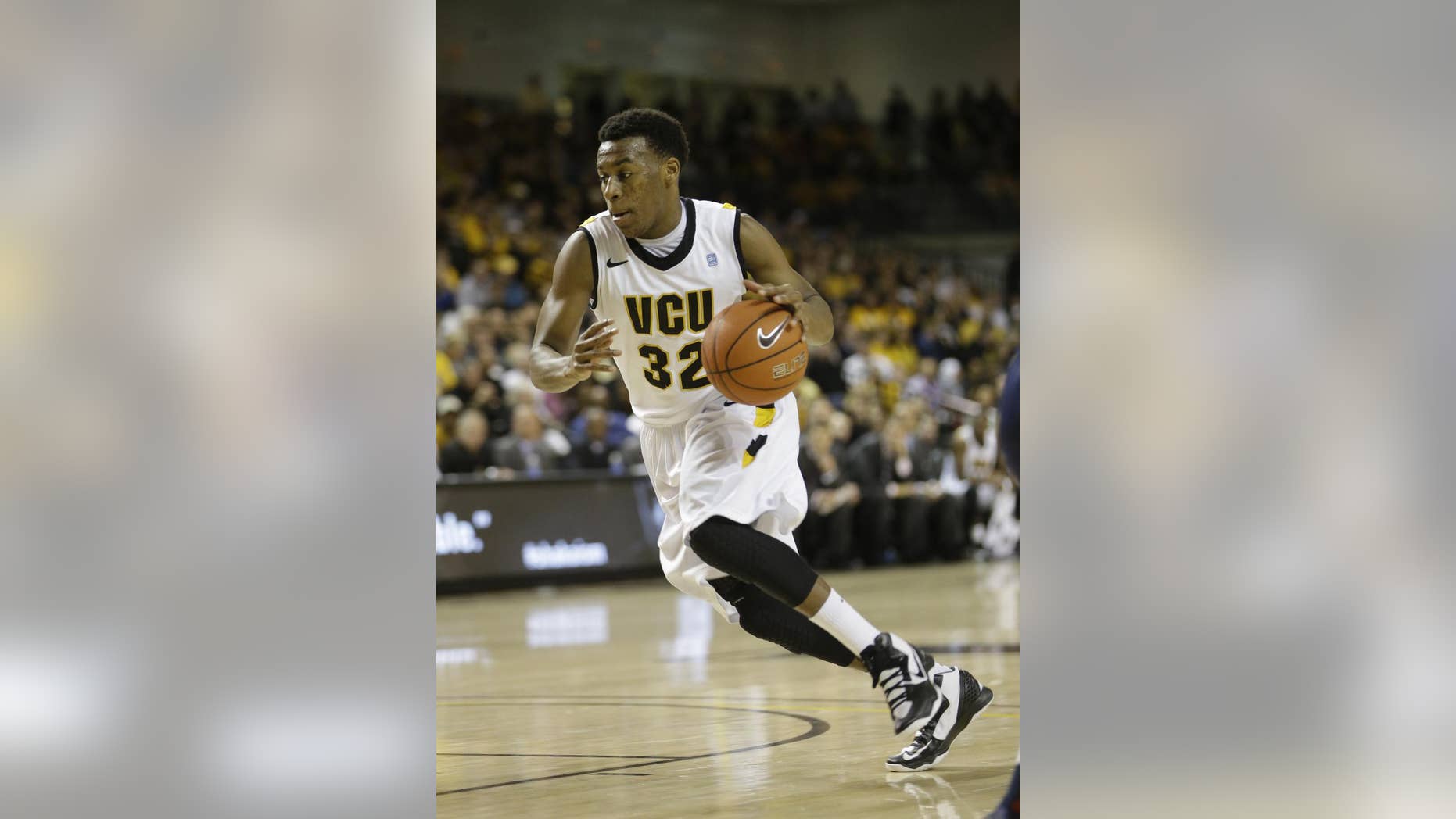 FILE - In this March 6, 2013, file photo, VCU guard Melvin Johnson (32) drives to the basket during the first half of an NCAA college basketball game in Richmond, Va. (AP Photo/Steve Helber, Fille)
