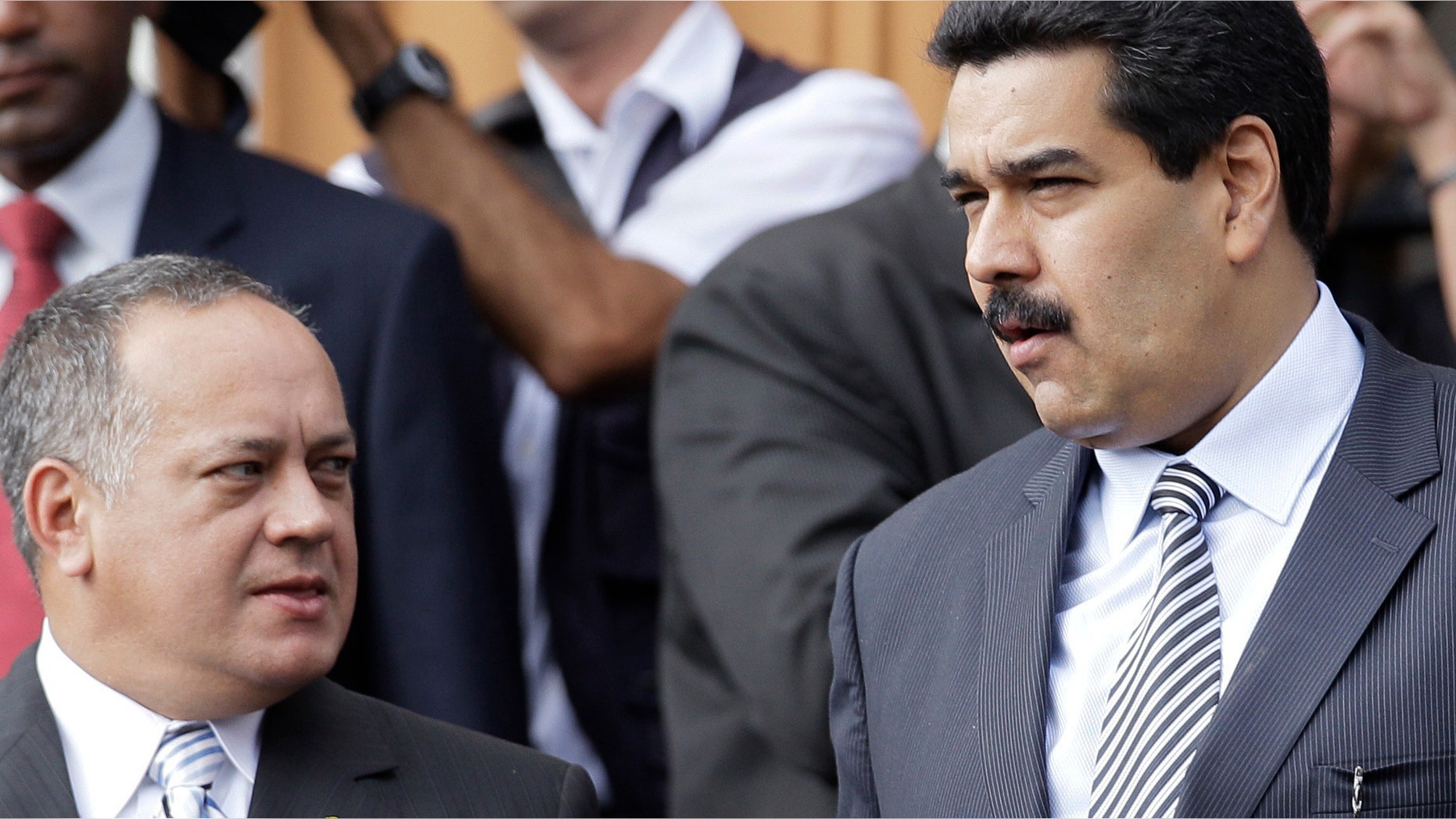 Venezuelan Vice President Nicolas Maduro, right, and President of the National Assembly Diosdado Cabello, attend a ceremony for the 182 anniversary of the death of Simon Bolivar in Caracas, December 17, 2012. (AP Photo / Ariana Cubillos)
