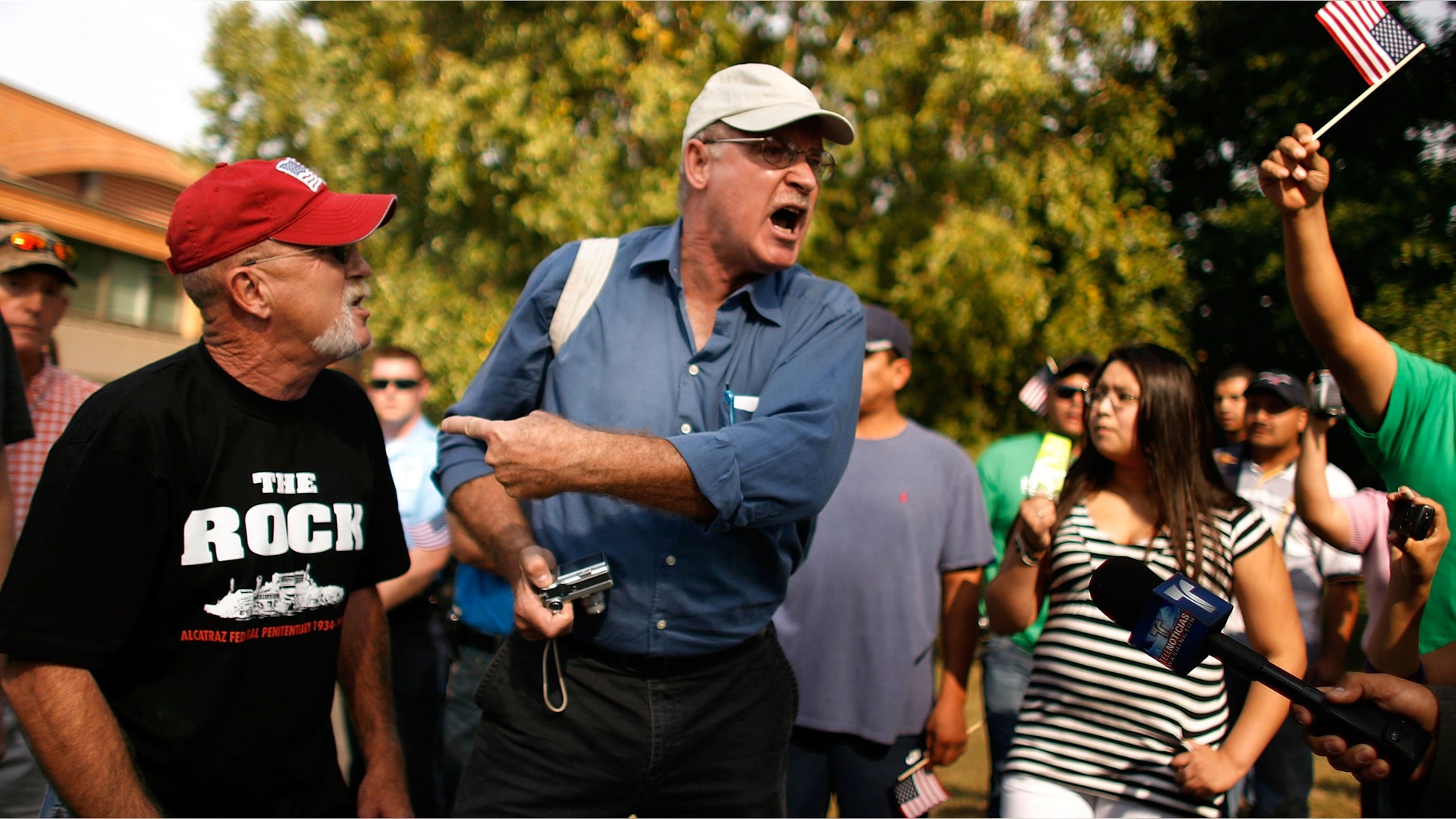 Phil Wilayto (C) exchanges heated words with anti-immigration proponents outside the building where the Prince William Board of County Supervisors are meeting to consider a new measure that would crack down on undocumented immigrants October 16, 2007 in Manassas, Virginia. (Photo by Chip Somodevilla/Getty Images)