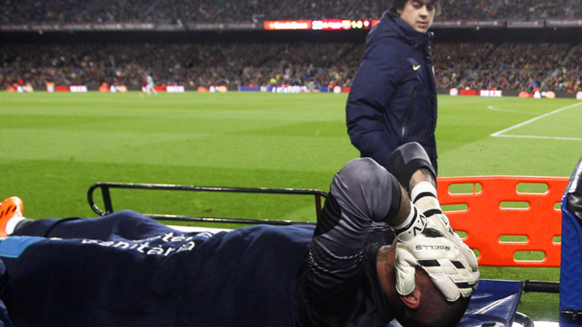 BARCELONA, SPAIN - MARCH 26: Victor Valdes of FC Barcelona lays injured during the La Liga match between FC Barcelona and RC Celta de Vigo at Camp Nou on March 26, 2014 in Barcelona, Spain. (Photo by Alex Caparros/Getty Images)