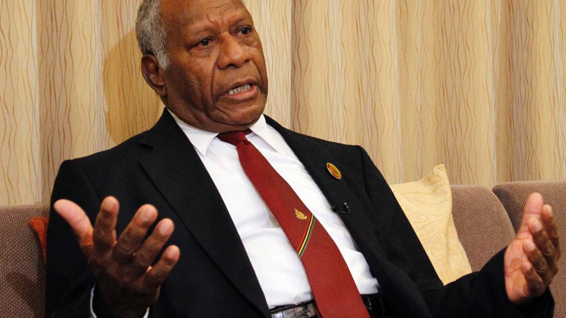 FILE - In this March 16, 2015 file photo, Vanuatu President Baldwin Lonsdale speaks during an interview in his hotel room in Sendai, Miyagi prefecture, northeastern Japan while attending a U.N. conference on disaster risk reduction. The South Pacific island nation of Vanuatu found itself in political chaos Tuesday, Oct. 13 following an extraordinary few days in which 14 lawmakers were found guilty of corruption but were then pardoned by one of their own while the president was abroad. The events have created a constitutional crisis for Lonsdale, who promised he would find a legal avenue to "clean up the mess." (AP Photo/Koji Ueda, File)
