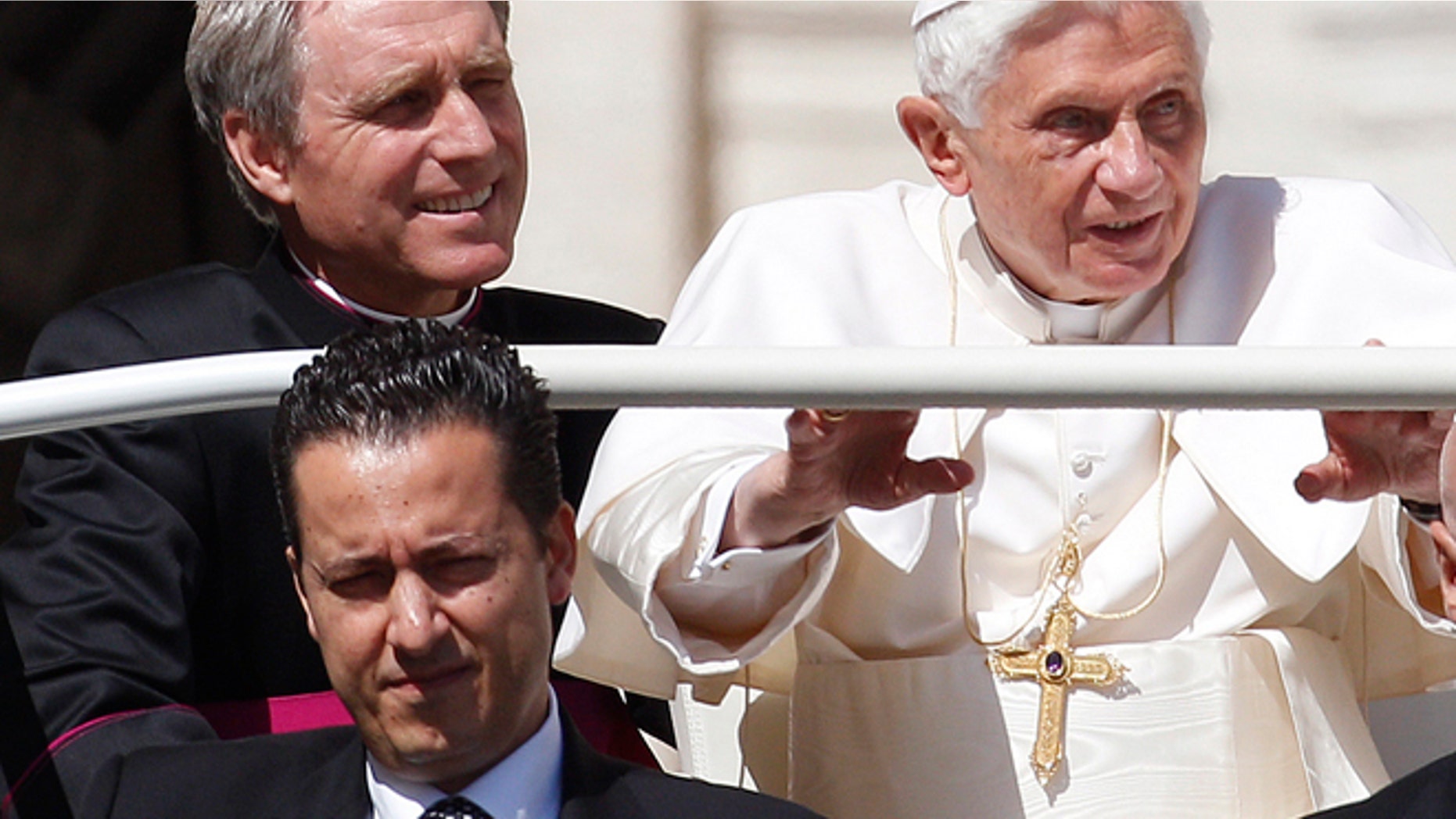 FILE 2012: Pope Benedict XVI, his then-butler Paolo Gabriele, bottom, and his personal secretary Georg Gaenswein sit in the car with him.