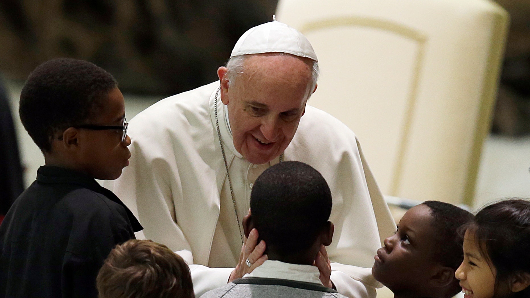 Pope Francis meets children at the Vatican, Saturday, Dec. 14, 2013.