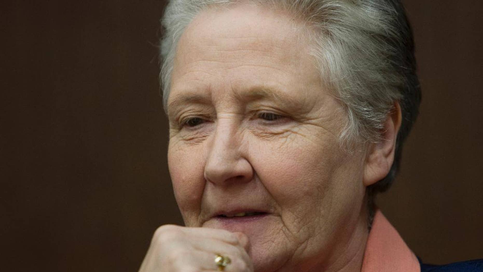 FILE - In this Tuesday, Feb. 7, 2012 file photo, Marie Collins, who was assaulted as a 13-year-old by a hospital chaplain in her native Ireland, attends a press conference at a Vatican-backed symposium on clerical sex abuse, in Rome. Marie Collins is not your ordinary papal adviser: Sexually assaulted as a child by a hospital chaplain, Collins went onto become a leading Irish activist demanding justice for victims of priestly abuse and a fierce critic of the Catholic Church’s handling of the scandal. She was named on Saturday, March 22, 2014 to Pope Francis' commission on setting sex abuse policy, one of eight people _ half of them women _ who will now help craft the panel’s scope and advise the church on best practices to protect children. In an interview with The Associated Press, Collins said her top priority was for the Vatican to punish those bishops who have covered up for priests who raped children. (AP Photo/Andrew Medichini, File)