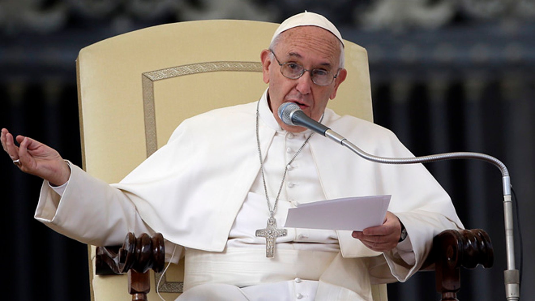 Oct. 14, 2015: Pope Francis delivers his blessing as he arrives in St. Peter's Square for the weekly general audience, at the Vatican.