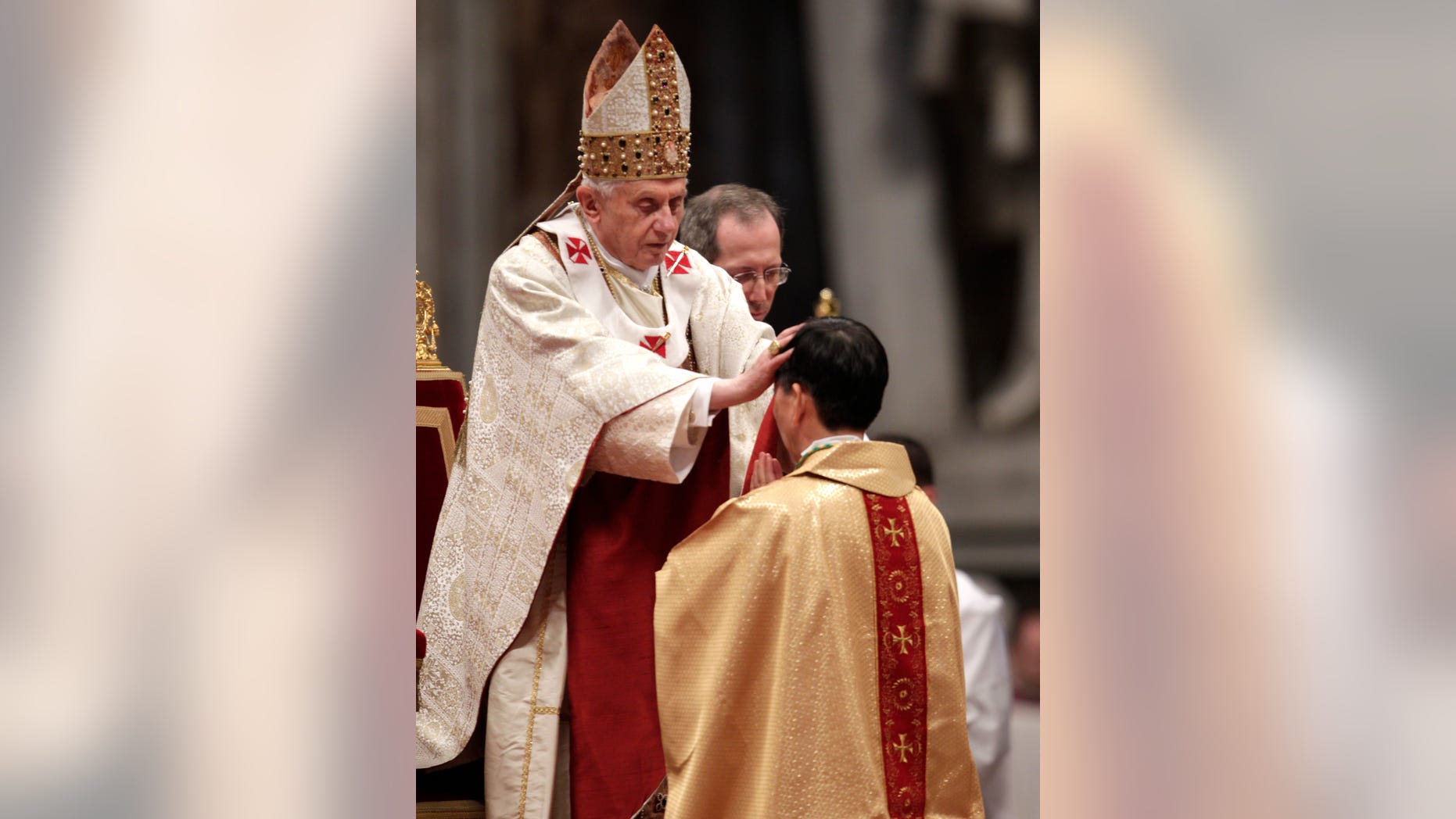 Newly ordained bishop Monsignor Savio Hon Tai-Fai, a 60-year-old Salesian prelate from Hong Kong, right, receives a blessing by Pope Benedict XVI during a ceremony in St. Peter's Basilica, at the Vatican, Saturday, Feb. 5, 2011. Benedict XVI insisted Saturday on his exclusive right to ordain bishops as he consecrated a Chinese prelate in an implicit challenge to attempts by China's official church to ordain bishops without his approval.