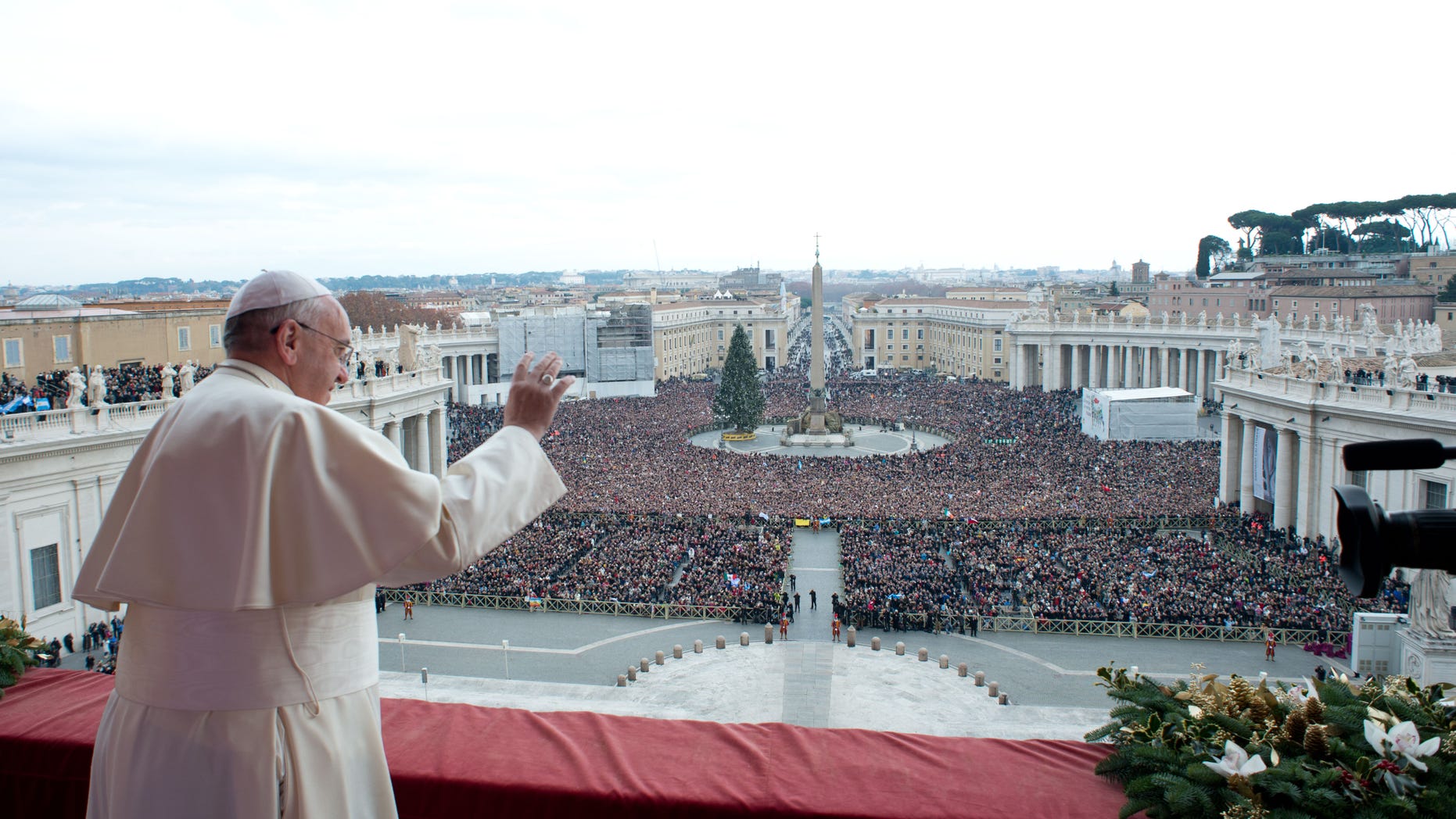 Dec. 25, 2013: In this picture provided by the Vatican newspaper L'Osservatore Romano, Pope Francis delivers his "Urbi et Orbi" (to the City and to the World) message from the central balcony of St. Peter's Basilica at the Vatican.