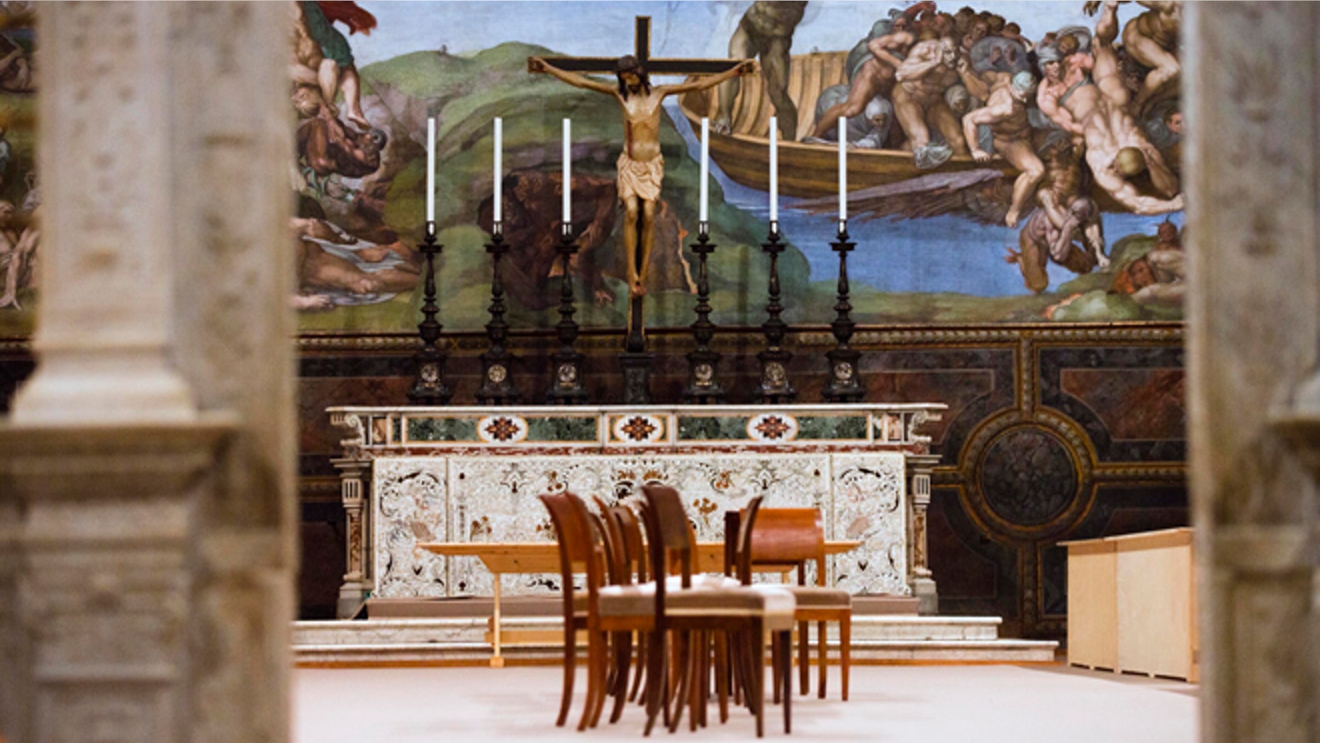 A partial view of the Sistine Chapel, at the Vatican, Saturday, March 9, 2013. Firefighters have installed the top of the Sistine Chapel chimney that will signal to the world that a new pope has been elected, while construction workers were preparing the chapel interior for the start of the papal conclave Tuesday. For such an important decision, the chimney is an awfully simple affair: a century-old cast iron stove where ballot papers are burned, with a copper pipe out the top that snakes up the Sistine's frescoed walls, out the window and onto the chapel roof. (AP Photo/Alessandra Tarantino)