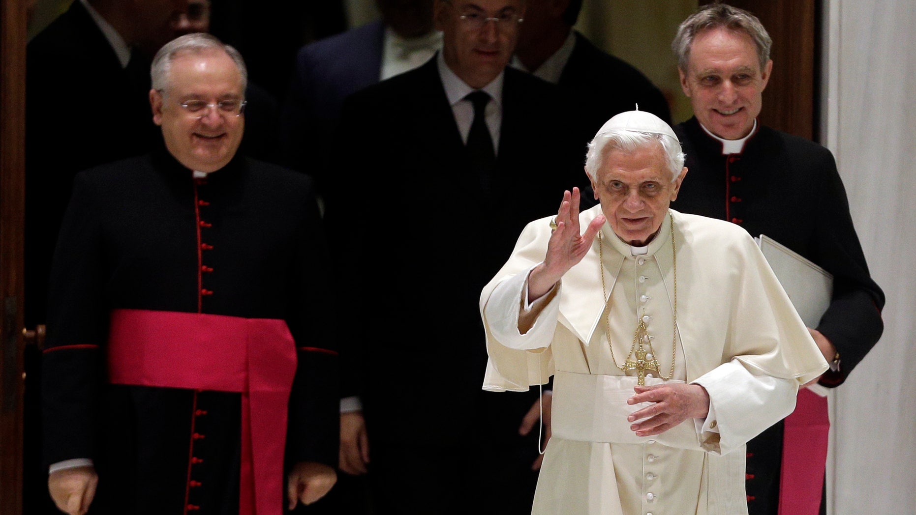 Dec. 5, 2012 - Pope Benedict XVI arrives for his weekly general audience followed by his personal secretary Georg Gaenswein, background right, and father Leonardo Sapienza, regent of the Prefecture of the Pontifical Household.