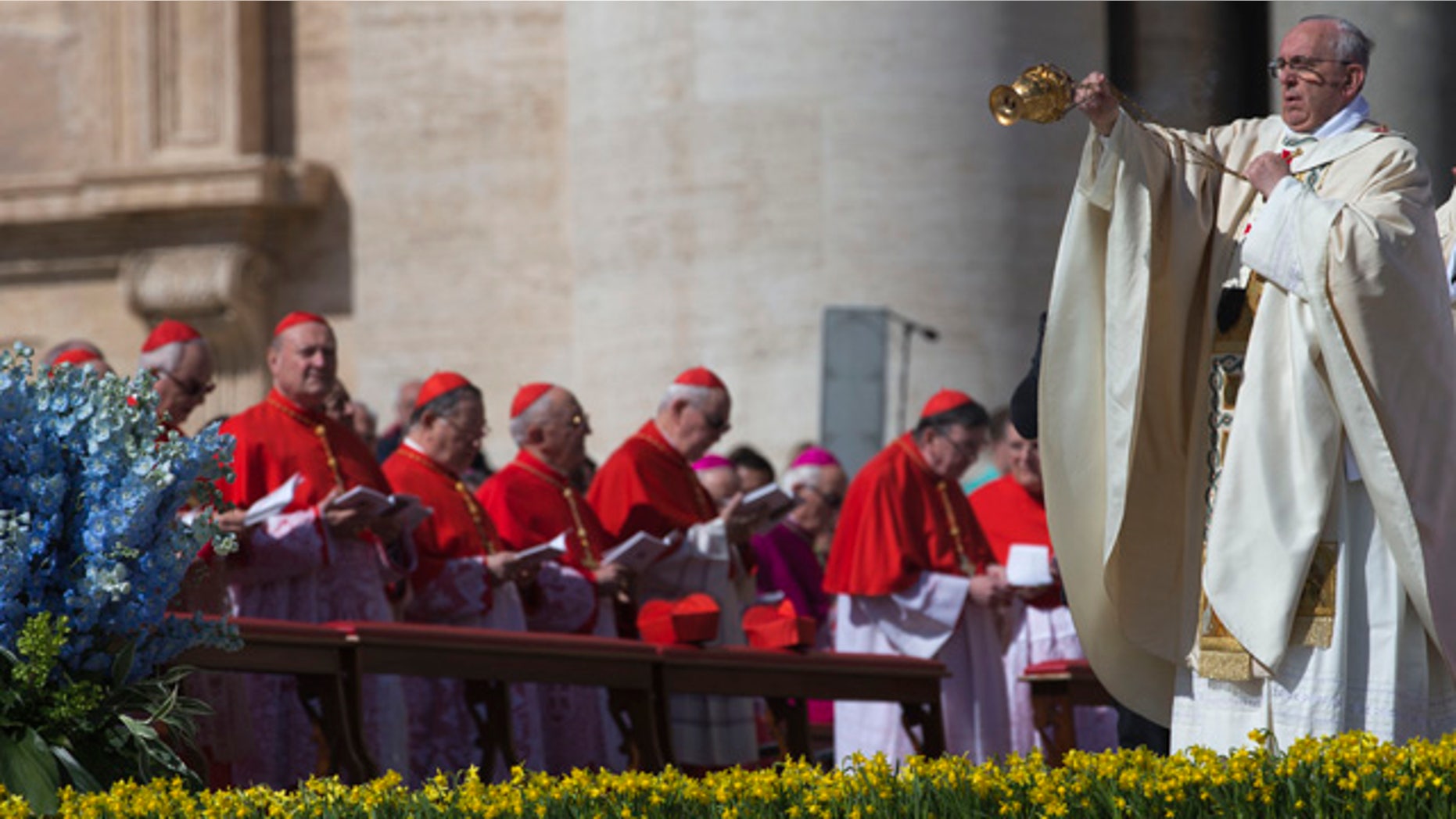 April 20, 2014: Pope Francis blesses the faithful with incense as he arrives to celebrate Easter Sunday Mass in St. Peter's Square at the Vatican. (AP Photo/Andrew Medichini)