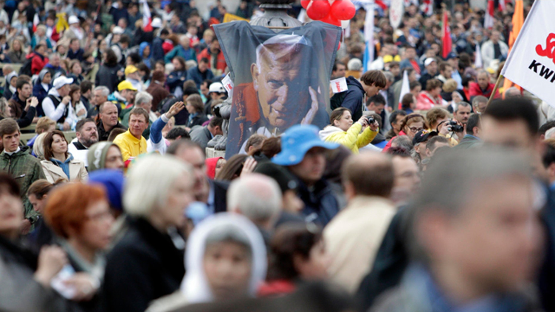 May 1: A picture of late Pope John Paul II emerges from the crowd prior to a solemn celebration led by Pope Benedict XVI where John Paul II will be beatified, in St. Peter's Square at the Vatican in the fastest beatification in modern times.