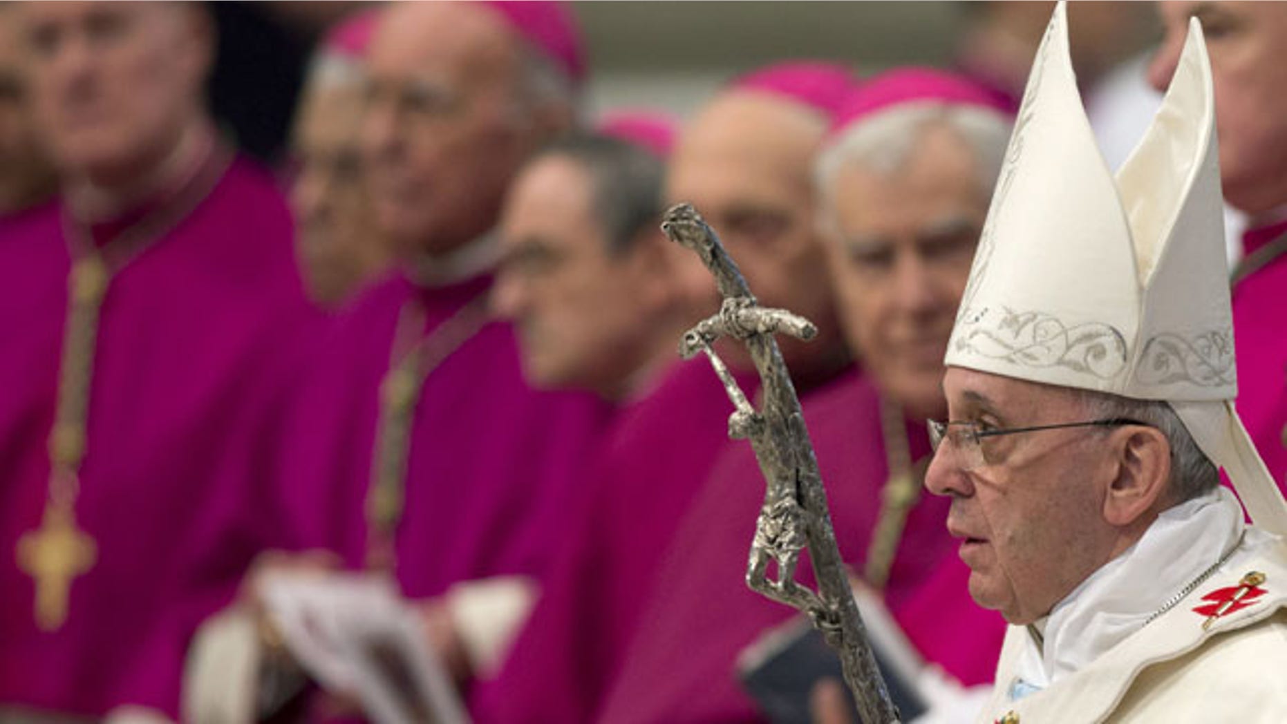 January 1, 2014: Pope Francis arrives to celebrate a Mass in St. Peter's Basilica at the Vatican. (AP Photo/Andrew Medichini)
