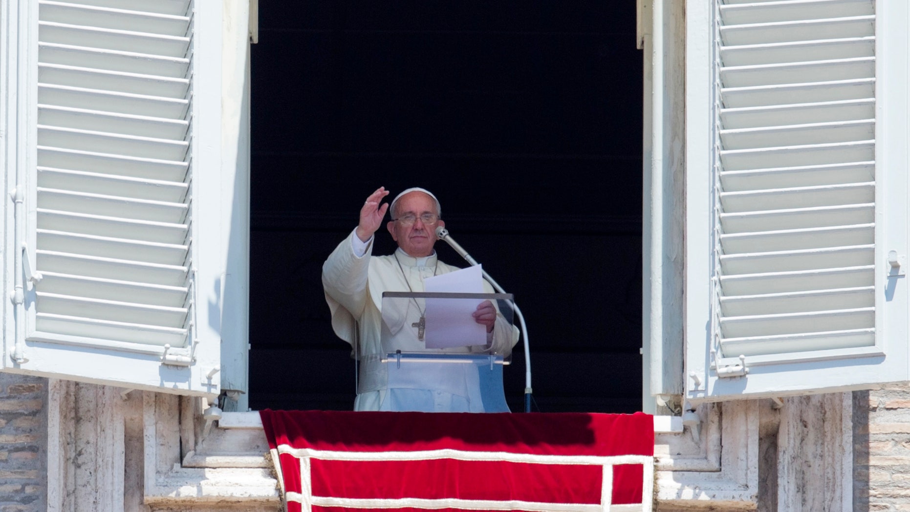 July 6, 2014 - Pope Francis celebrates the Angelus noon prayer from his studio window overlooking St. Peter's square, at the Vatican.