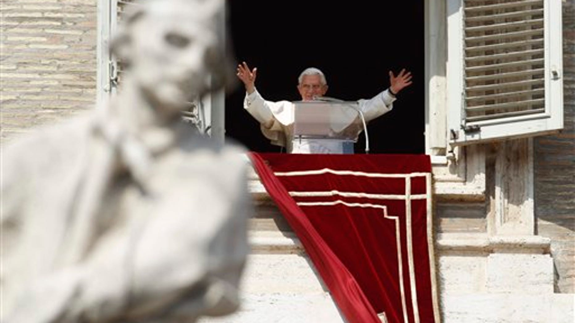 March 18: Pope Benedict XVI greets faithful during the Angelus prayer from his studio window overlooking St. Peter's Square at the Vatican. Pope Benedict XVI has asked for prayers for his upcoming trip to Mexico and Cuba.