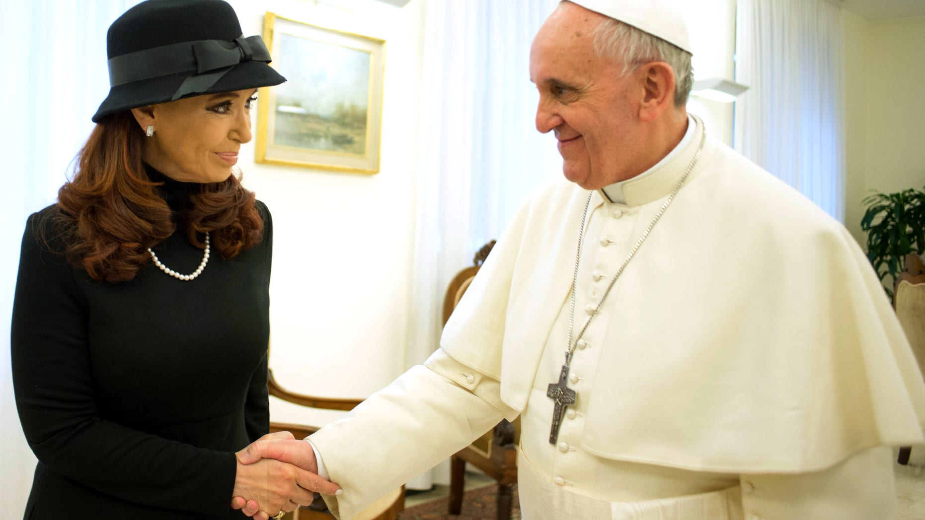 In this photo provided by the Vatican paper L'Osservatore Romano, Pope Francis meets Argentine President Cristina Fernandez at the Vatican, Monday, March 18, 2013.