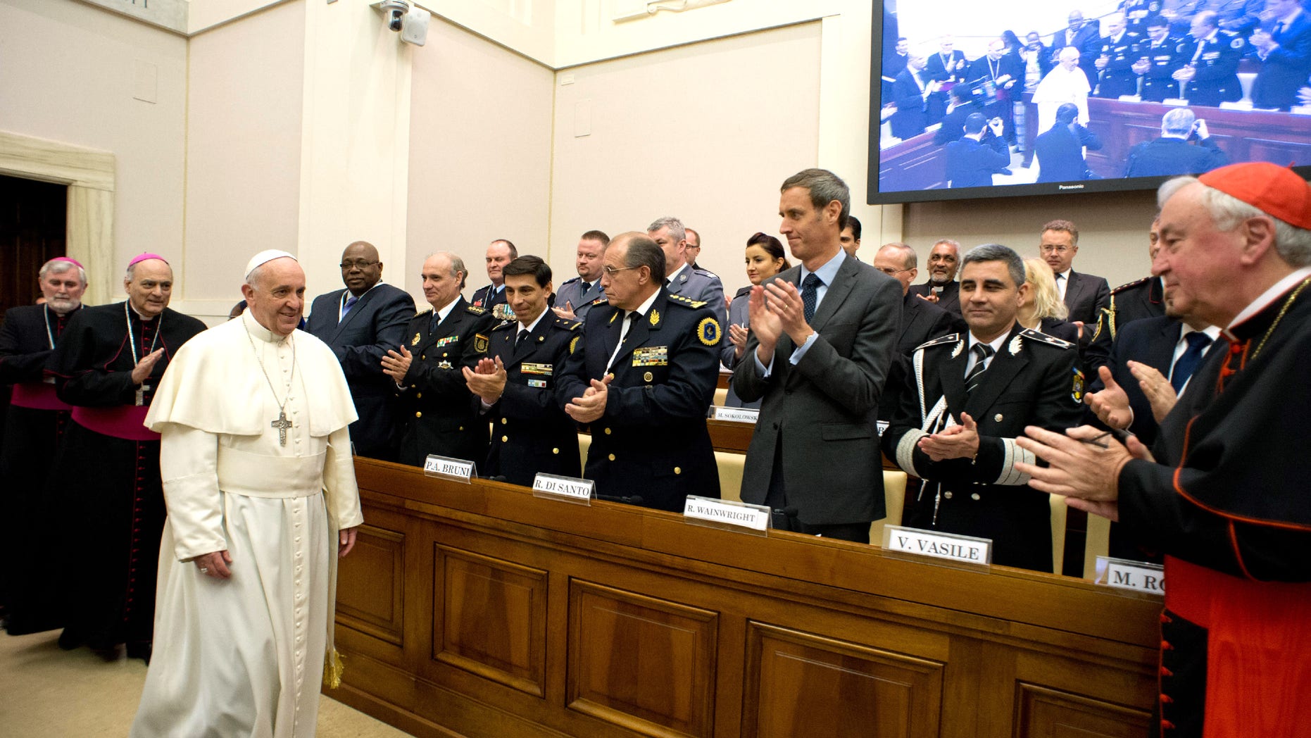 Pope Francis arrives at a conference about the human trafficking, at the Vatican, Thursday, April 10, 2014.