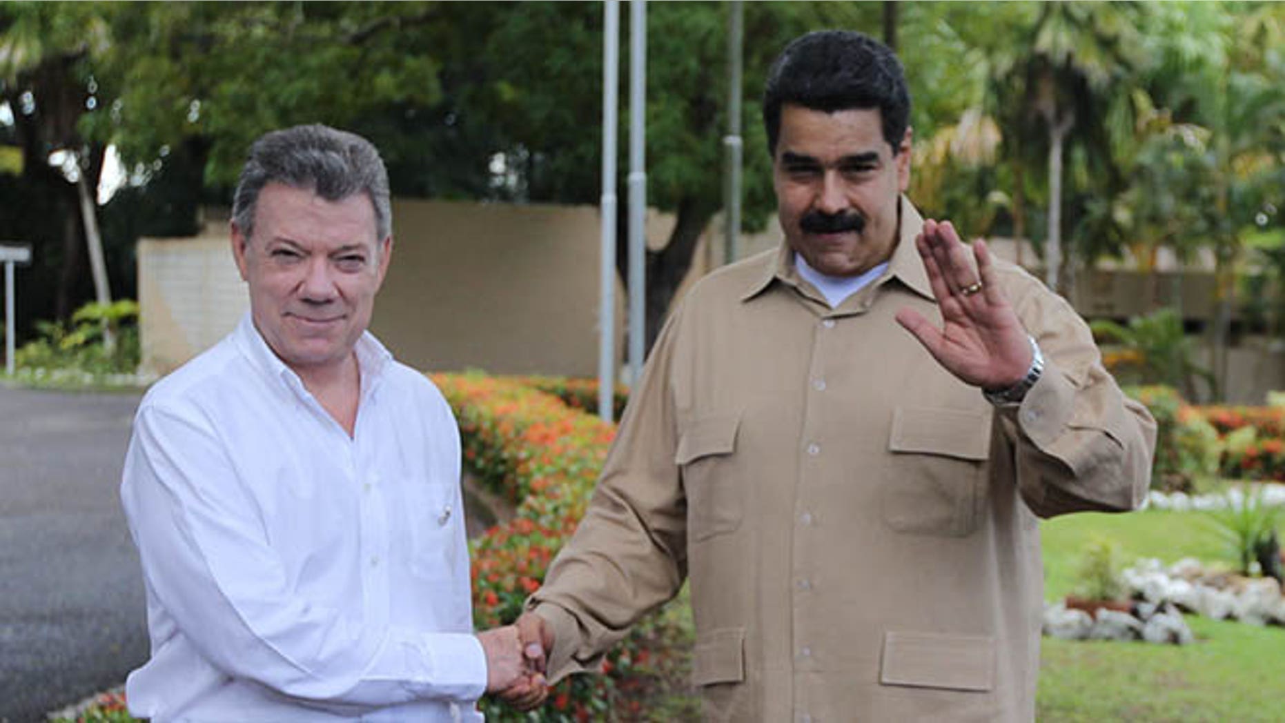 Venezuela's President Nicolas Maduro, right, and Colombian counterpart Juan Manuel Santos, in Puerto Ordaz, Venezuela, Thursday, Aug. 11, 2016.