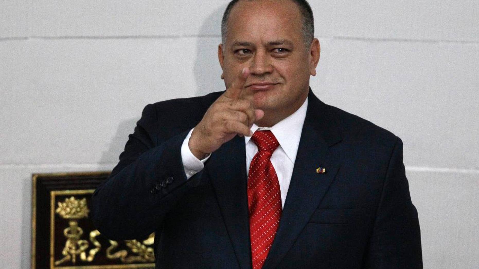 FILE - In this Jan. 5, 2013, file photo, National Assembly President Diosdado Cabello gestures before addressing the National Assembly in Caracas, Venezuela. The powerful head of Venezuela's congress moved Wednesday, Jan. 28, 2015, to distance himself from a bodyguard who defected to the United States and reportedly has implicated his former boss as head of drug ring of political and military officials. (AP Photo/Ariana Cubillos, File)