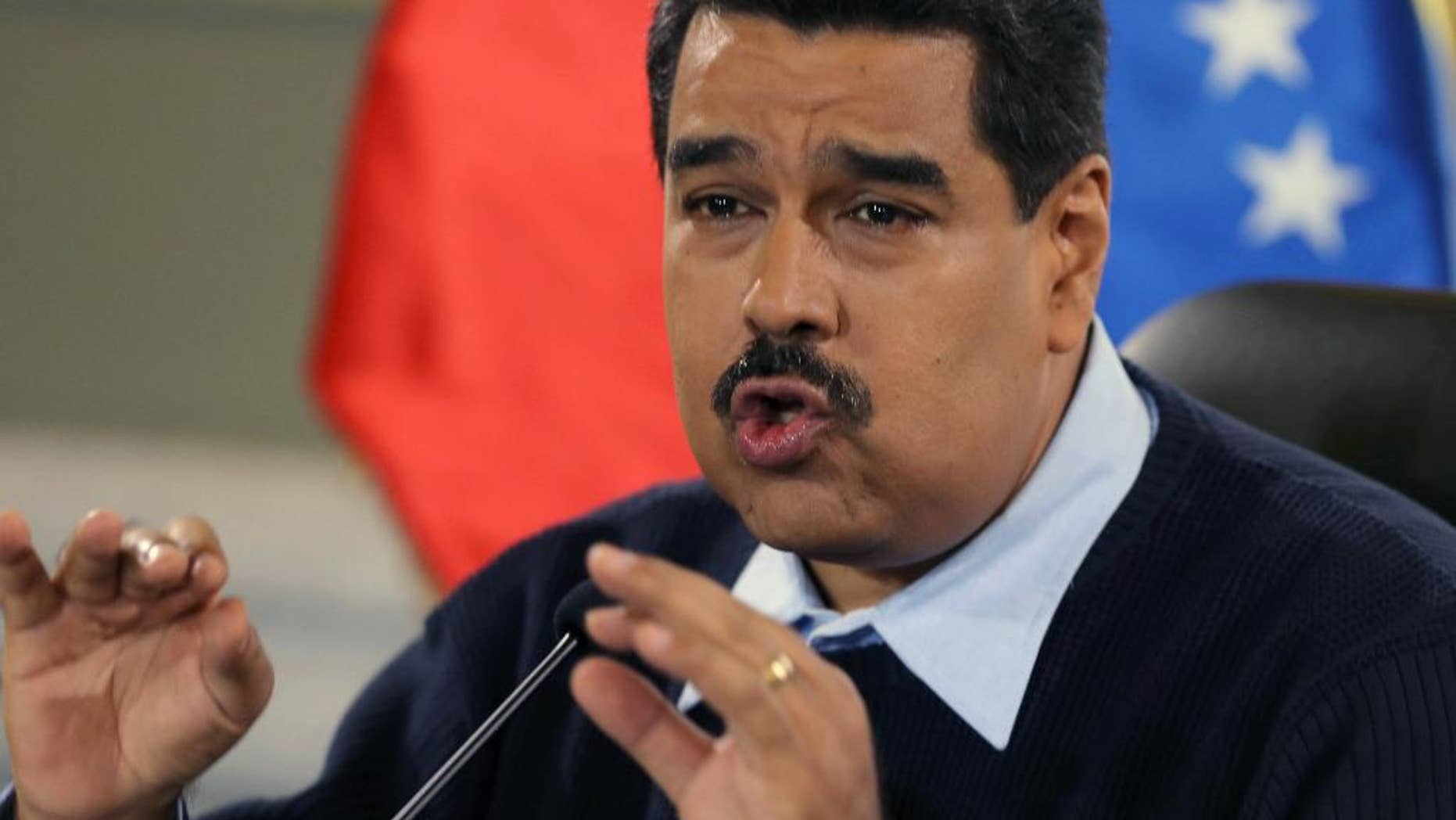 FILE - In this Aug. 24, 2015 file photo, Venezuela's President Nicolas Maduro gives a news conference at Miraflores presidential palace in Caracas, Venezuela. On Sunday, Oct. 18, 2015, Maduro called for prosecution of Lorenzo Mendoza, Venezuela’s biggest businessman, president of the Empresas Polar conglomerate, for allegedly conspiring to destabilize his government. (AP Photo/Fernando Llano, File)