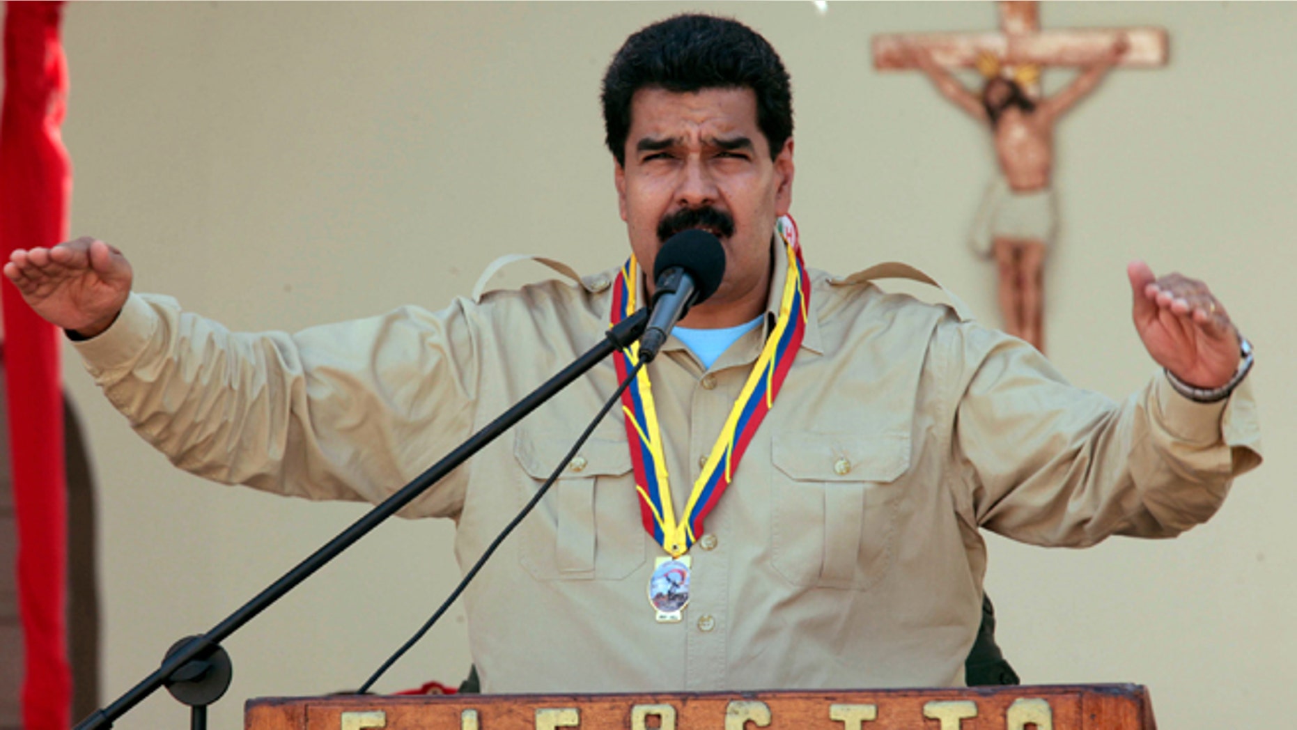 In this photo released by Miraflores Press Office, Venezuela's Nicolas Maduro speaks to soldiers inside a military base in Coro, Venezuela, Monday, Sept. 30, 2013. Maduro said Monday that his government was expelling the top U.S. diplomat in Venezuela and two other embassy employees for allegedly conspiring with the political opposition. (AP Photo/Miraflores Press Office)