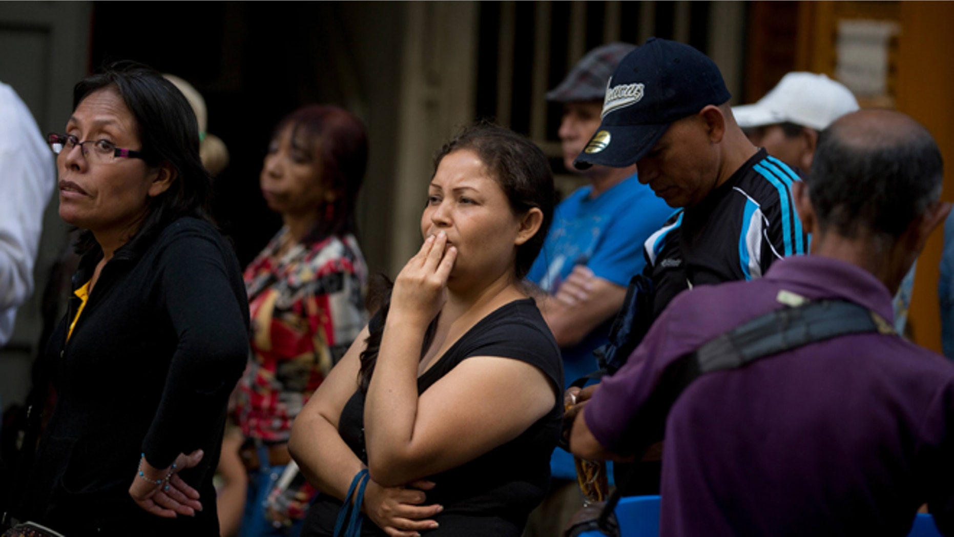 People wait in a line outside a supermarket in Caracas, Venezuela, to buy price regulated toilet paper made available for sale by the government, Friday, Jan. 22, 2016. In a note published Friday, the International Monetary Fund Western Hemisphere Director Alejandro Werner said inflation would more than double in the economically struggling South American country in 2016, reaching 720 percent. (AP Photo/Fernando Llano)