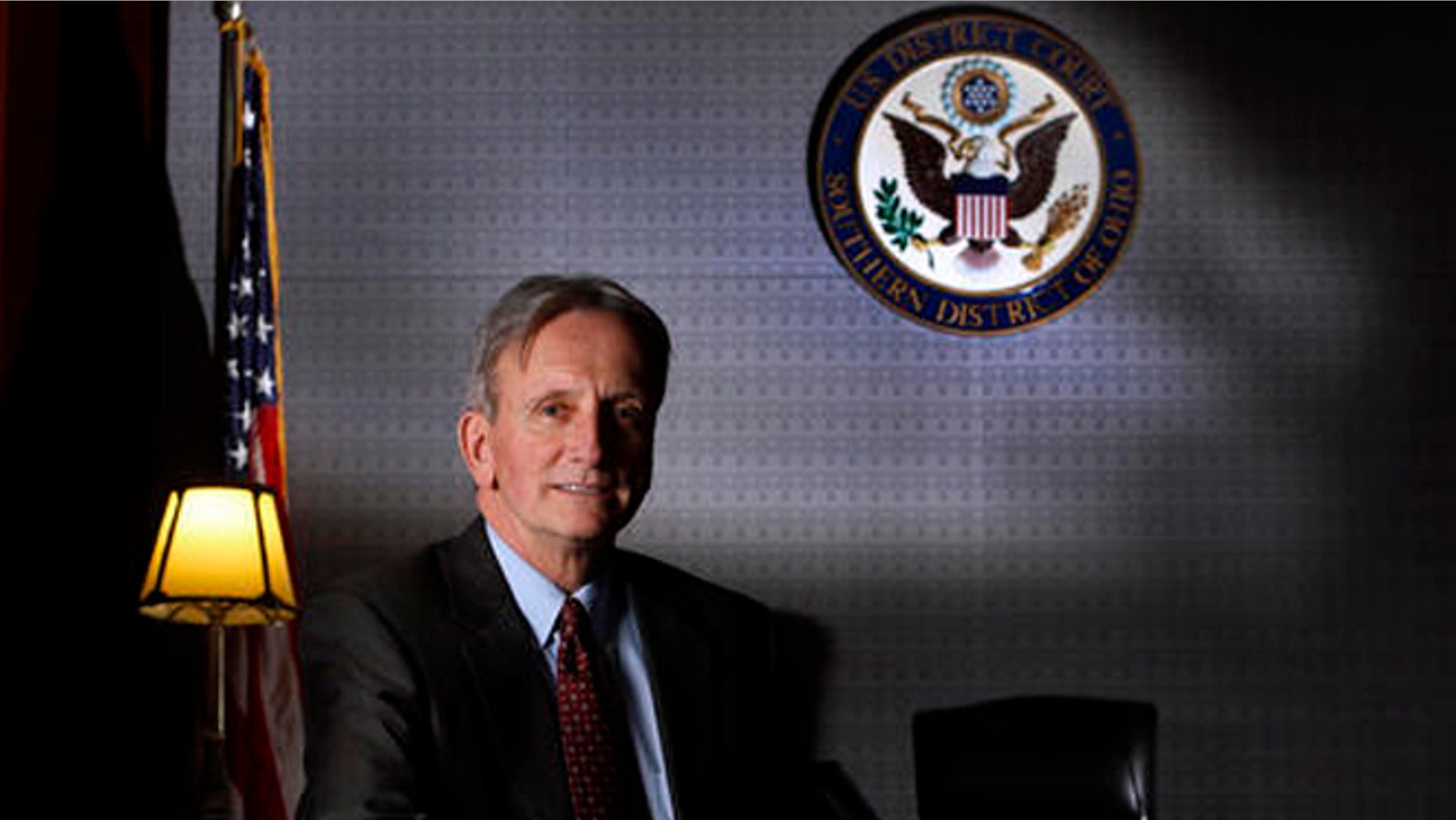 FILE - In this Jan. 6, 2015, file photo, Chief Judge Edmund Sargus of the U.S. District Court's Southern District of Ohio poses for a photo in Columbus, Ohio. In a Friday, July 22, 2016, ruling, Sargus of the U.S. District Court's Southern District of Ohio rejected a $100 million investors' lawsuit against Venezuela over three-decade old promissory notes issued by a now-defunct government-sponsored Venezuelan bank, in a case that included allegations of fraud, hints of an international criminal conspiracy and references to diamonds, junk bonds and a house fire in Switzerland. (Eric Albrecht/The Columbus Dispatch via AP, File)