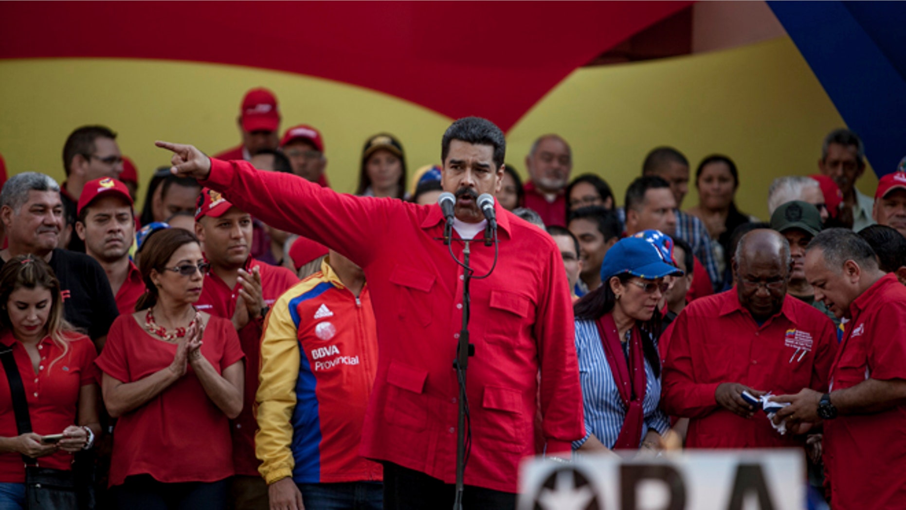 Venezuela's President Nicolas Maduro speaks during a political rally against the opposition-controlled congress, in Caracas, Venezuela, Tuesday, Oct. 25, 2016. After the government suspended a recall referendum seeking Maduro's removal last week, the congress began debating his "constitutional situation." Lawmakers vow to present evidence that Maduro is a dual Colombian citizen and therefore constitutionally ineligible to hold Venezuela's highest office. (AP Photo/Alejandro Cegarra)