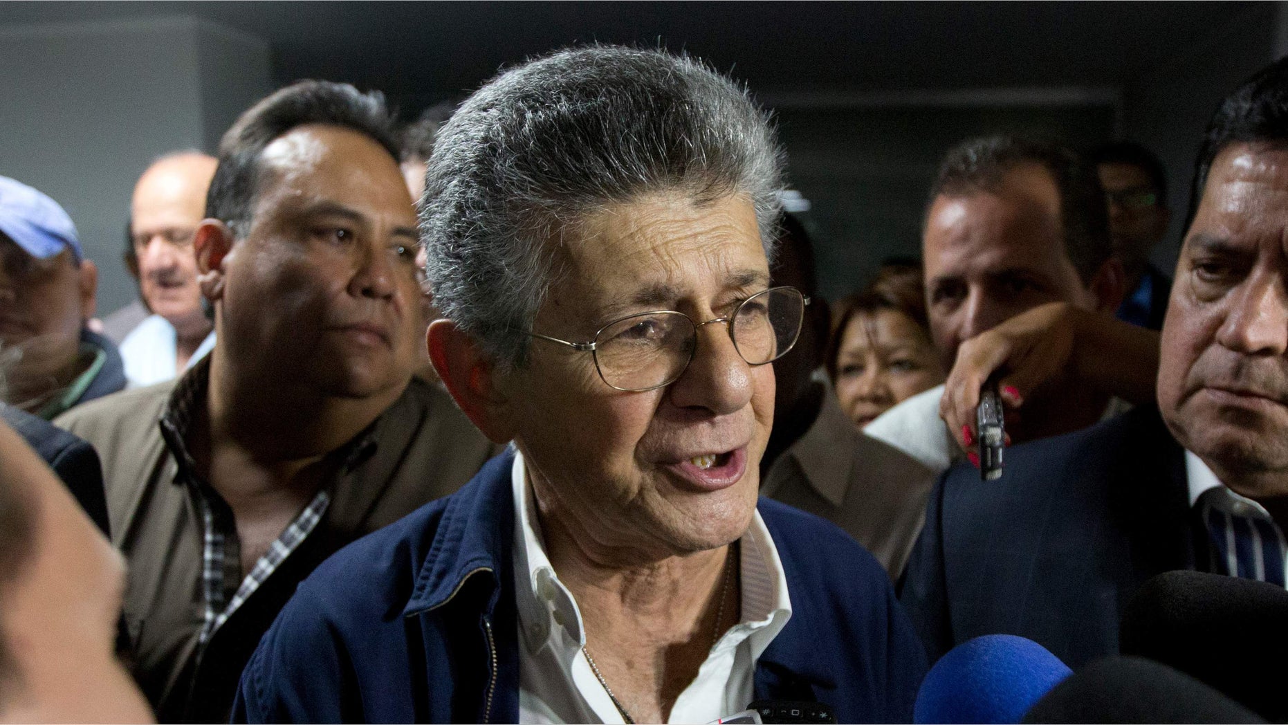 Congressmen Henry Ramos Allup speaks with media after he was elected as the Venezuela National Assembly's President in Caracas, Venezuela, Sunday, Jan. 3, 2016. Newly-elected opposition lawmakers voted in Ramos as National Assembly president Sunday. (AP Photo/Fernando Llano)