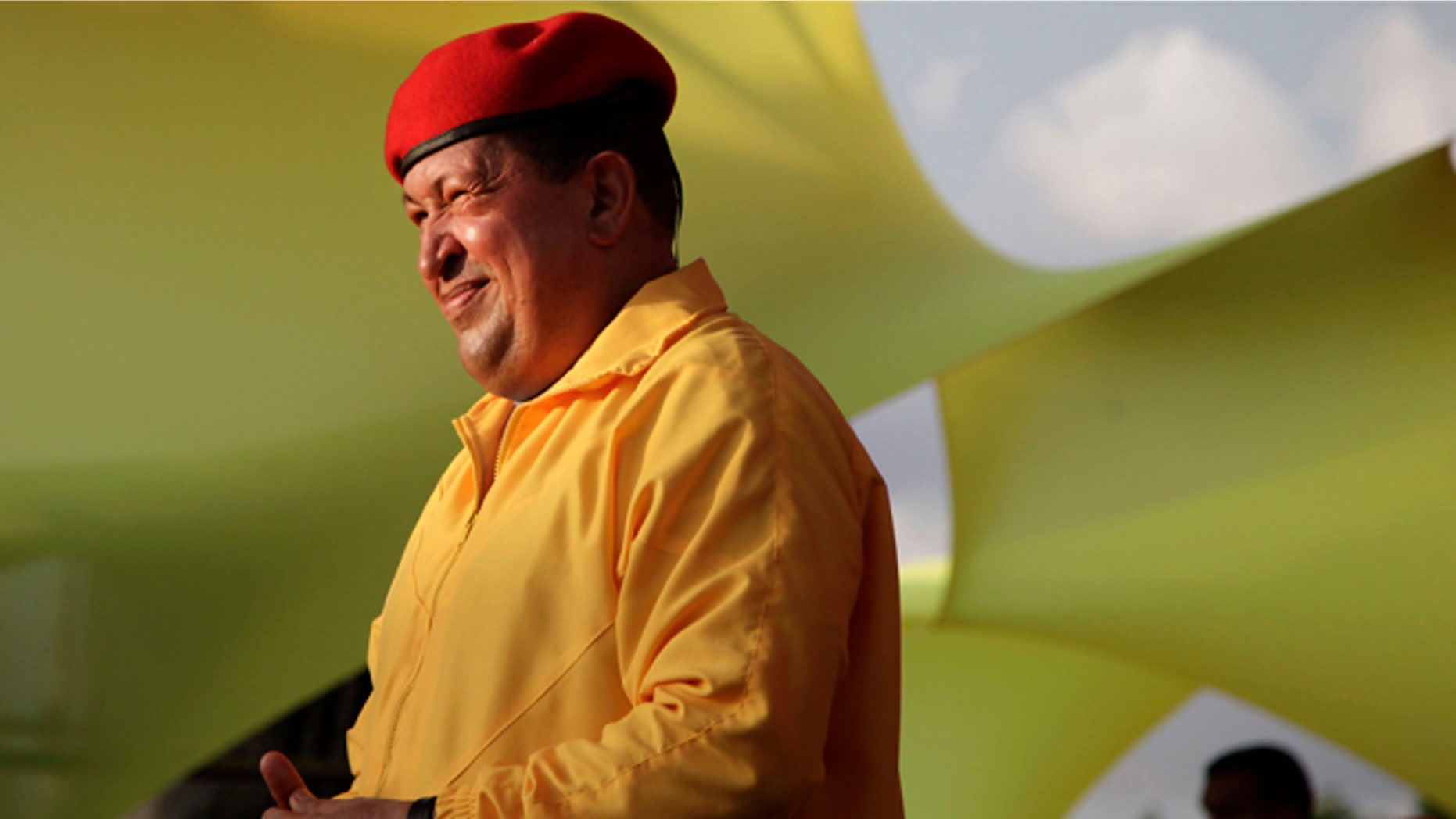 FILE - In this July 14, 2012 file photo, Venezuela's President Hugo Chavez smiles at a campaign rally in Barquisimeto, Venezuela. When he takes the stage at campaign rallies, Chavez stands alone. Under Venezuela's election system, presidential hopefuls dont choose running mates. The lack of a No. 2 leaves voters with a big unknown ahead of next month's presidential election and raises question about who in fact would take over were Chavez to win and leave office prematurely. (AP Photo/Ariana Cubillos,File)