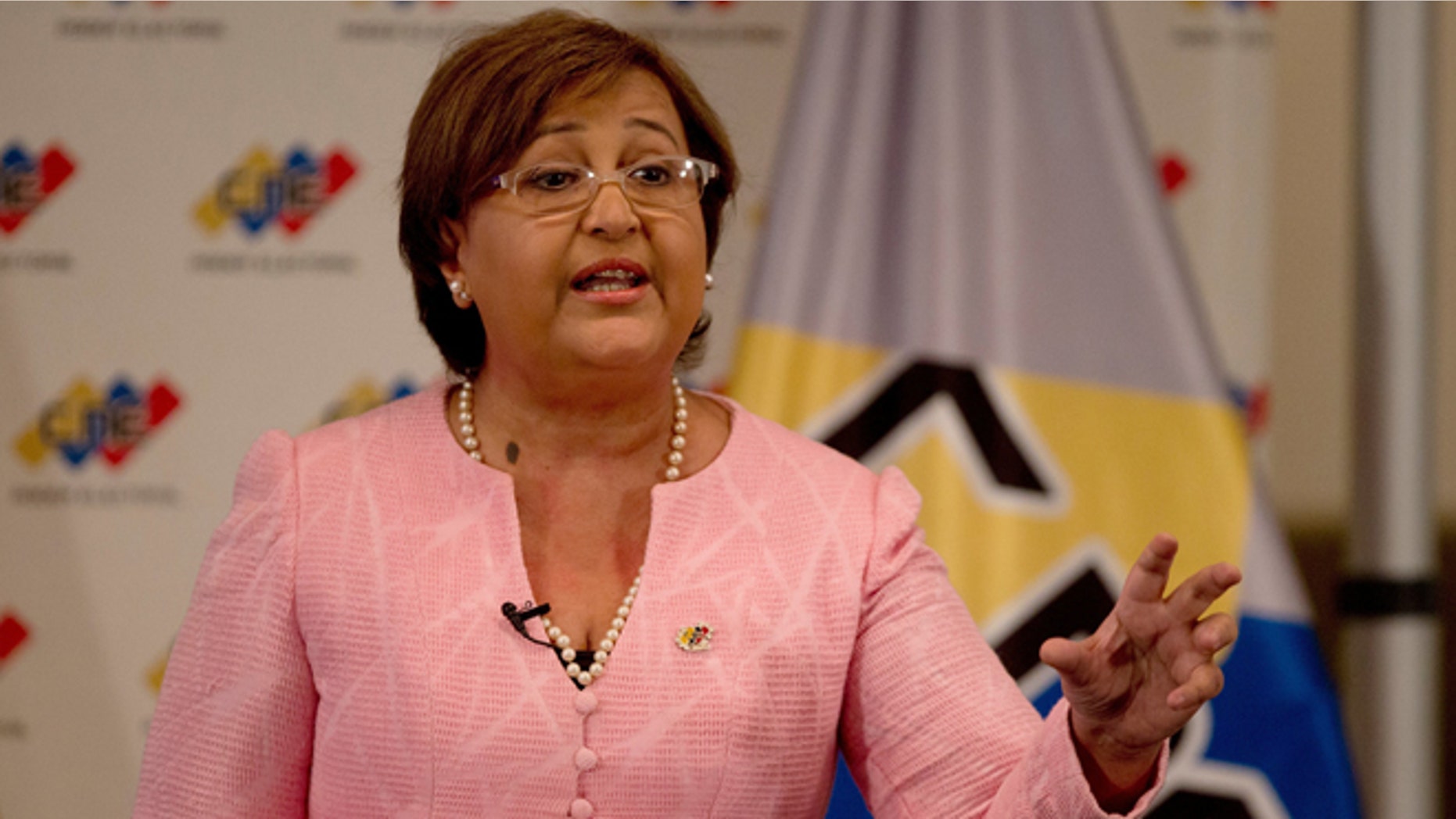 National Elections Council President Tibisay Lucena speaks during a televised nation wide speech, from her office in Caracas, Venezuela, Tuesday, Aug. 9, 2016. Venezuelan elections officials have set an October date for a recall drive against President Nicolas Maduro. (AP Photo/Fernando Llano)