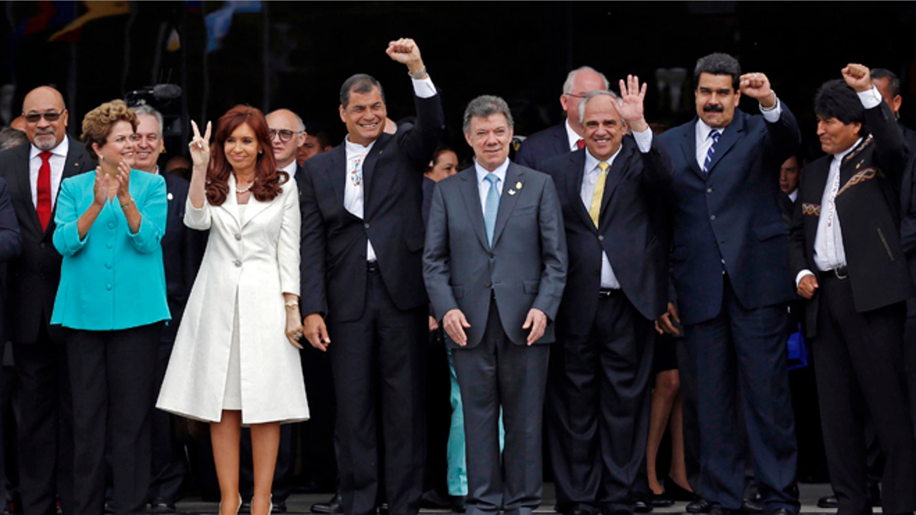 FILE - In this Dec. 5, 2014 file photo, UNASUR leaders pose for a group photo at the inauguration of the new UNASUR headquarters building in Quito, Ecuador. From left to right are Suriname's President Desi Bouterse, Brazil's President Dilma Rousseff, Argentina's President Cristina Fernandez, Ecuador's President Rafael Correa, Colombia's President Juan Manuel Santos, UNASUR General Secretary and former Colombian President Ernesto Samper, Venezuela's President Nicolas Maduro, and Bolivia's President Evo Morales. The South American regional bloc did attempt to mediate between the Venezuelan government and the opposition last year. But that effort fell through, and observers see those leaders as loath to try again. (AP Photo/Dolores Ochoa, File)