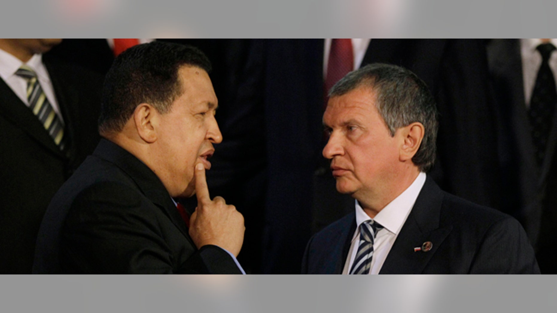 Venezuelaâs President Hugo Chavez, left, speaks with Igor Sechin, the CEO of Russia's state-controlled Rosneft oil company, after a meeting at Miraflores presidential palace in Caracas, Venezuela, Thursday, Sept. 27, 2012. Chavez has built close ties with Russia, and on Thursday, a joint venture involving state oil company Petroleos de Venezuela SA and a consortium of Russian oil companies began to tap a rich deposit of heavy oil in eastern Venezuela. (AP Photo/Ariana Cubillos)