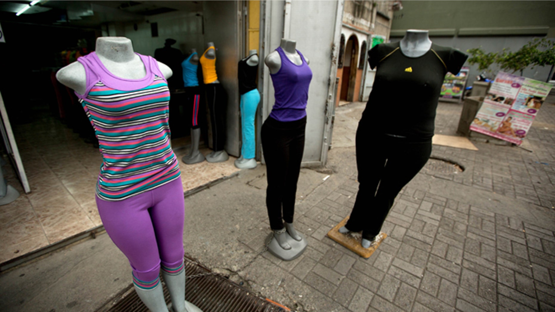 Mannequins stand at a store that sells clothing for over weight people in downtown Caracas, Venezuela, Tuesday, Aug. 26, 2014. The Venezuelan government has launched a public relations campaign to halt a steady rise in obesity that, if left unchecked, threatens to lead to a costly, public health crisis. (AP Photo/Fernando Llano)