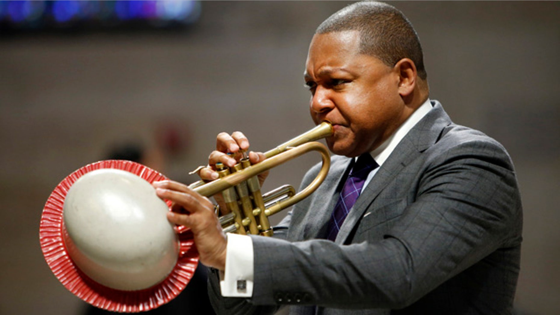 FILE - In this Sept. 20, 2014, file photo, musician Wynton Marsalis performs during a memorial service for actress Ruby Dee at The Riverside Church in New York. (AP Photo/Jason DeCrow, File)