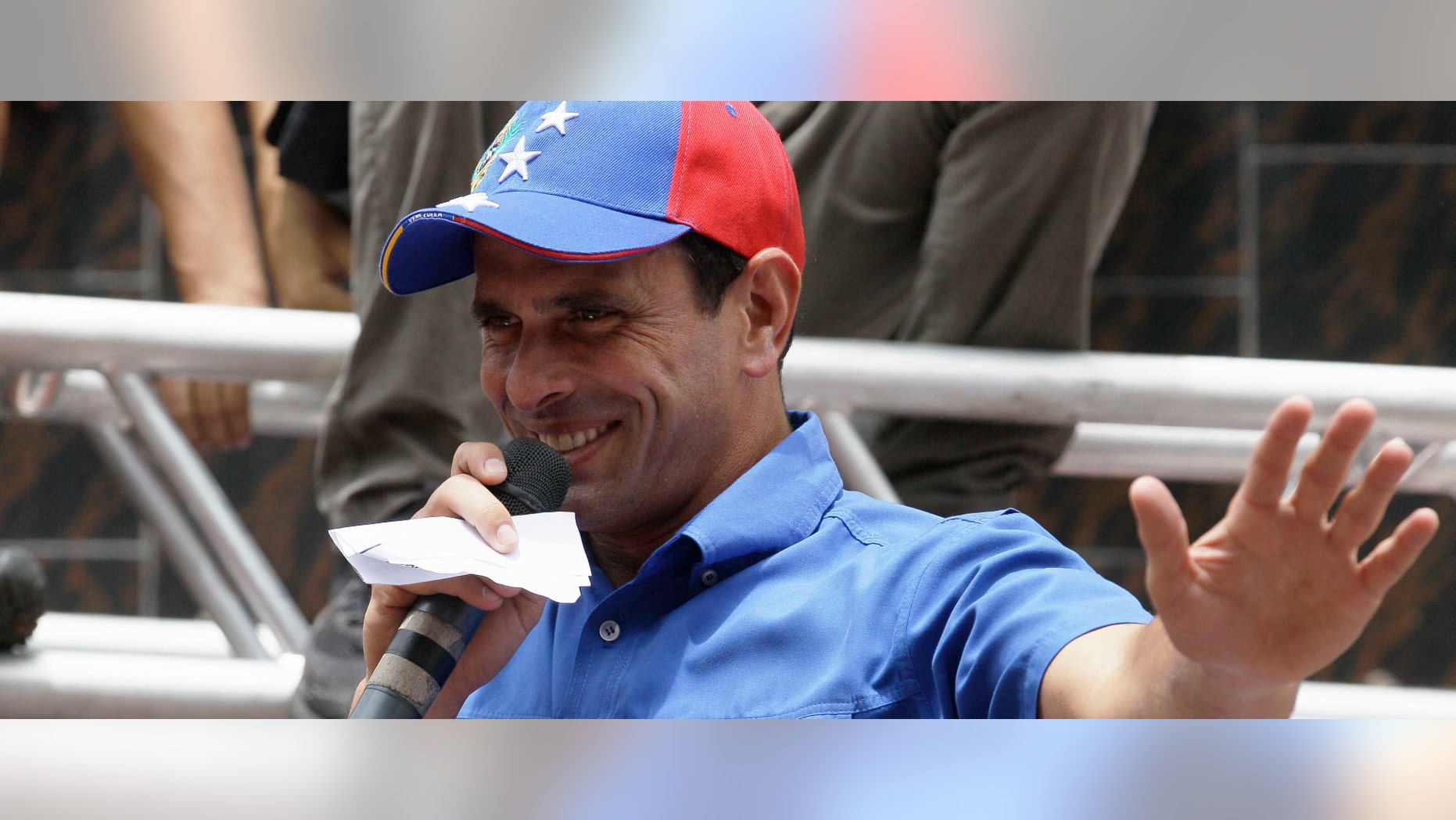 Venezuela's Presidential candidate Henrique Capriles speaks to supporters at a campaign rally in El Junko, near Caracas, Venezuela, Friday, Aug. 3, 2012. Venezuela's presidential election is scheduled for Oct. 7.(AP Photo/Fernando Llano)