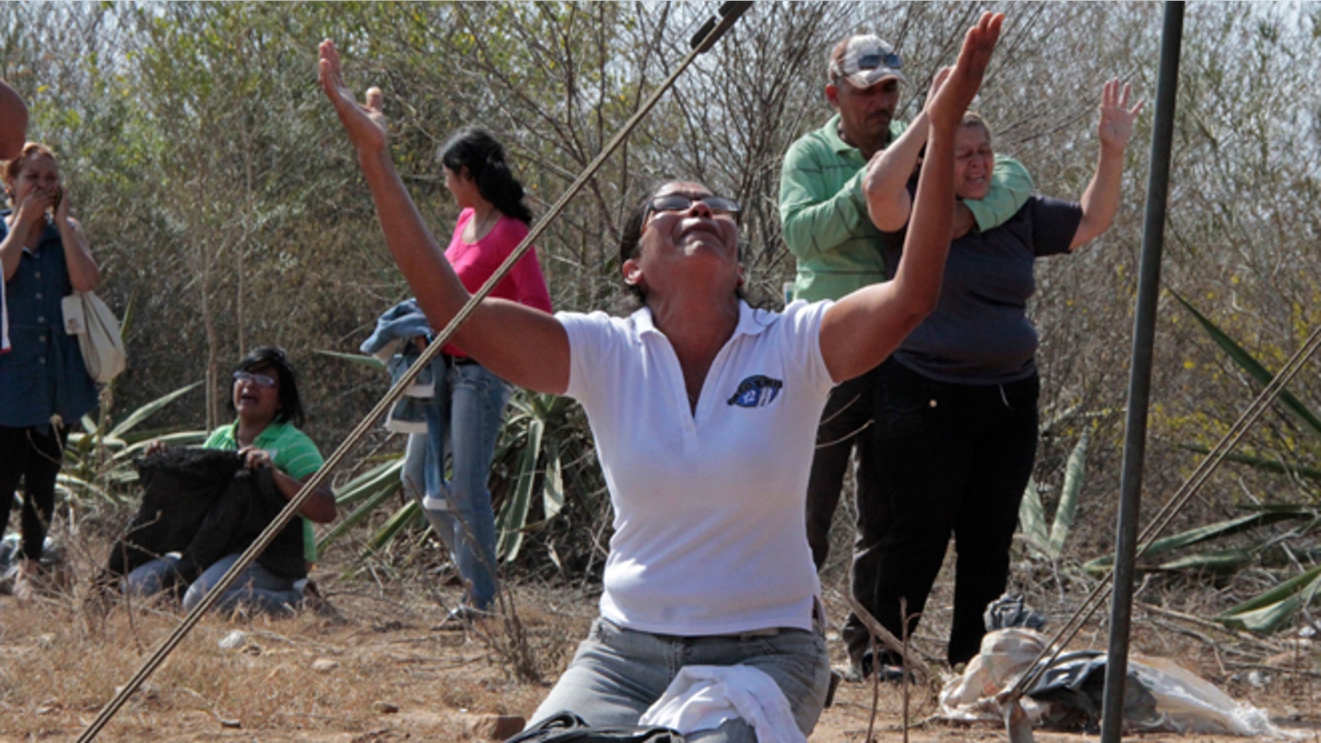 Jan. 25, 2013: Relatives of inmates react outside the Uribana prison in Barquisimeto, Venezuela.