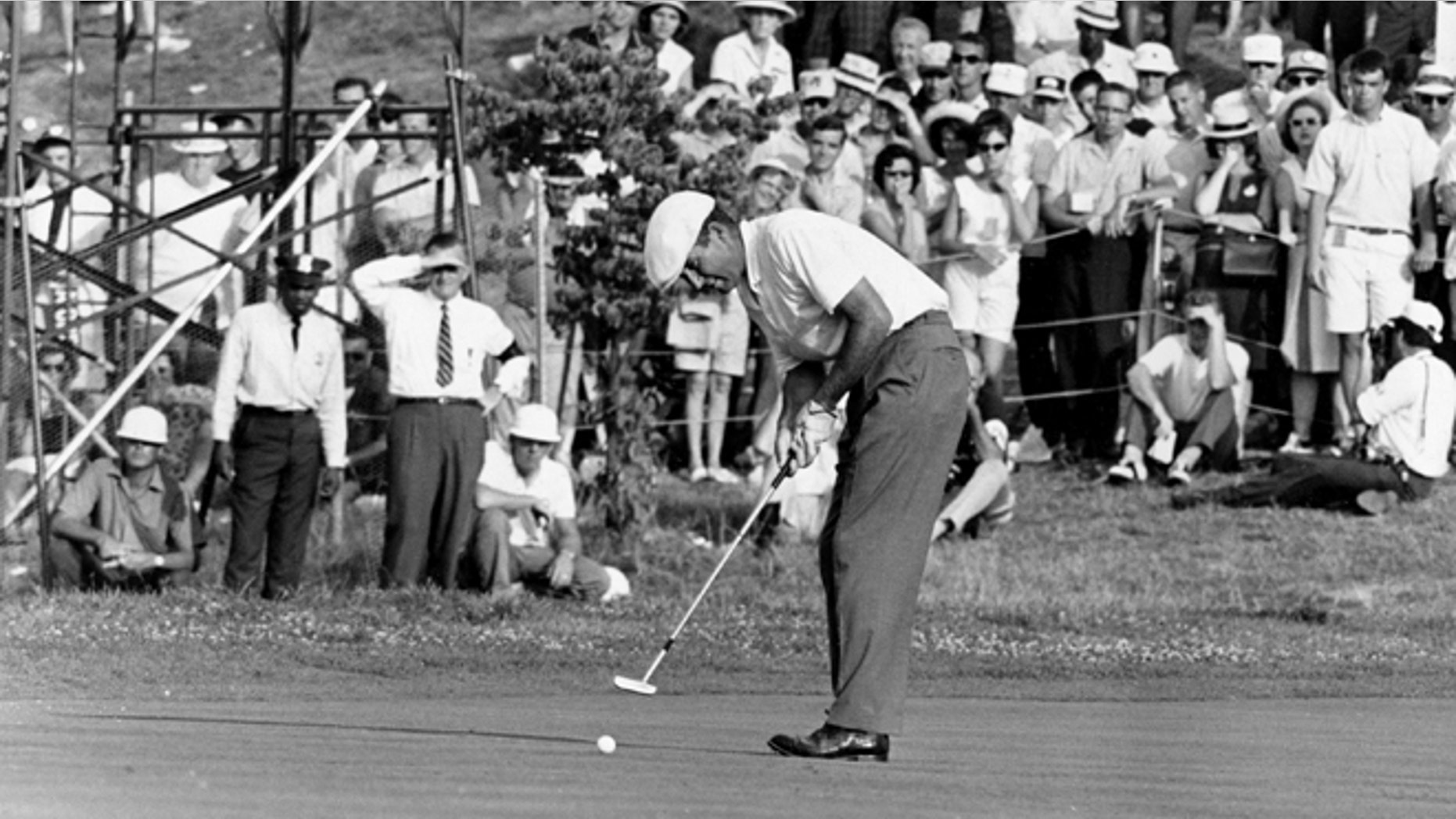 June 20, 1964: This file photo shows Ken Venturi making the final putt on the 18th green during the U.S. Open Golf Championship at Congressional Country Club in Bethesda, Md.