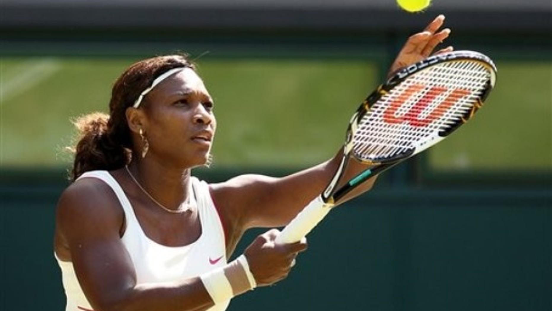 Venus Williams of the United States prepares to serve during her quarterfinal match against China's Li Na at the All England Lawn Tennis Championships at Wimbledon, Tuesday, June 29, 2010. (AP Photo/Anja Niedringhaus)