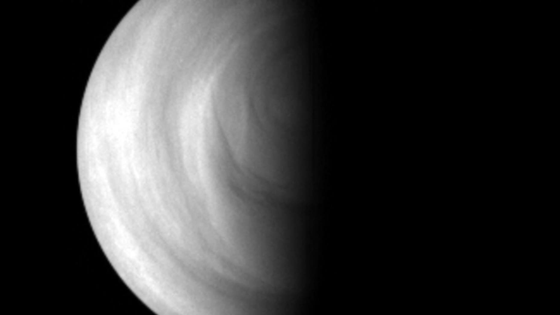 The terminator of Venus (the line between day and night) as seen by the Venus Express spacecraft in May 2006.