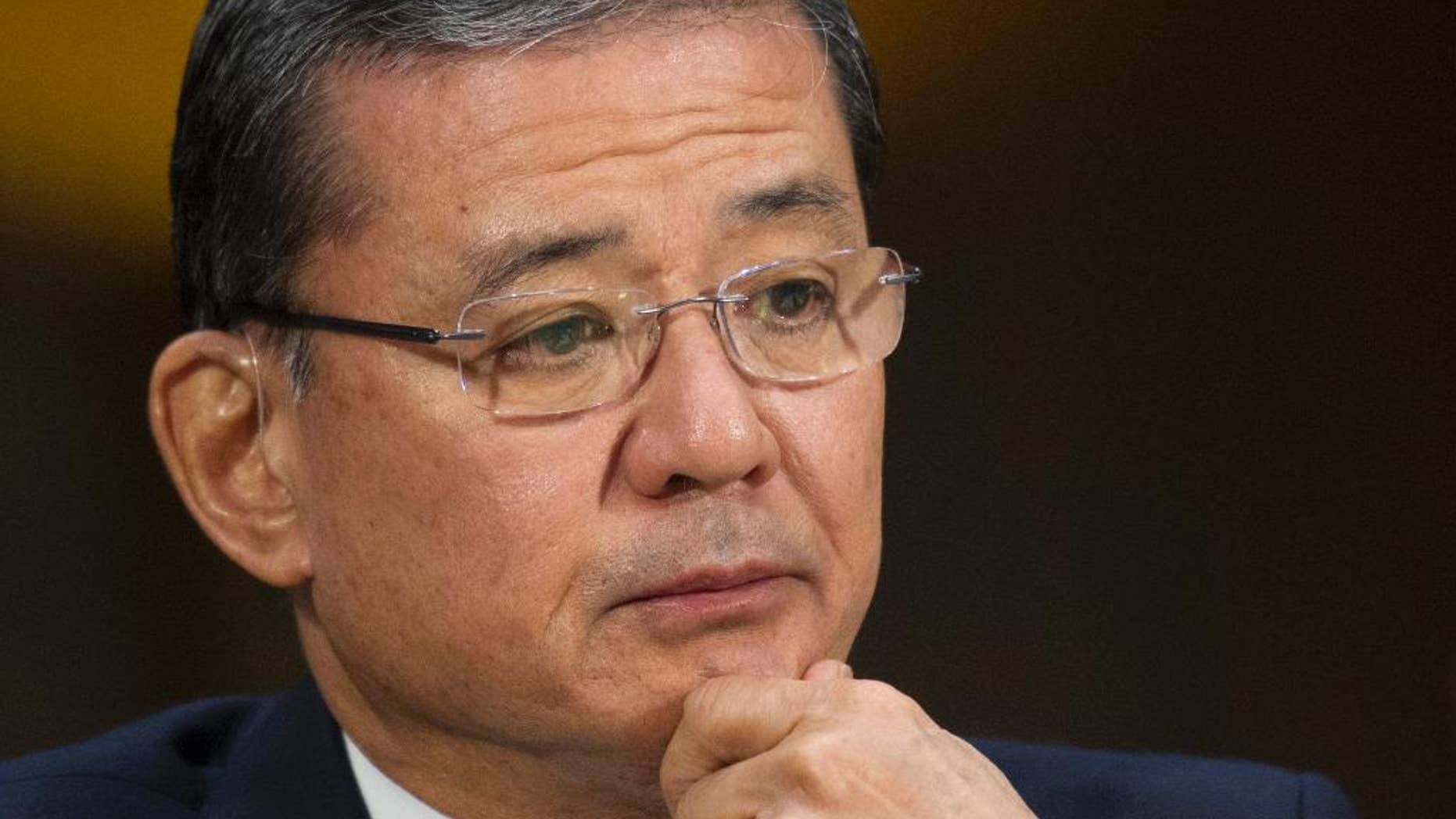 FILE - This May 15, 2014 file photo shows Veterans Affairs Secretary Eric Shinseki testifying on Capitol Hill in Washington. Veterans at the Phoenix veterans hospital waited on average 115 days for their first medical appointment _ 91 days longer than the hospital reported, the Veterans Affairs Department’s inspector general said Wednesday. Rep. Jeff Miller, R-Fla., chairman of the House Veterans Affairs Committee, and Sen. John McCain, R-Ariz., immediately called for VA Secretary Eric Shinseki to resign. Miller also said Attorney General Eric Holder should launch a criminal investigation into the VA. (AP Photo/Cliff Owen, File)