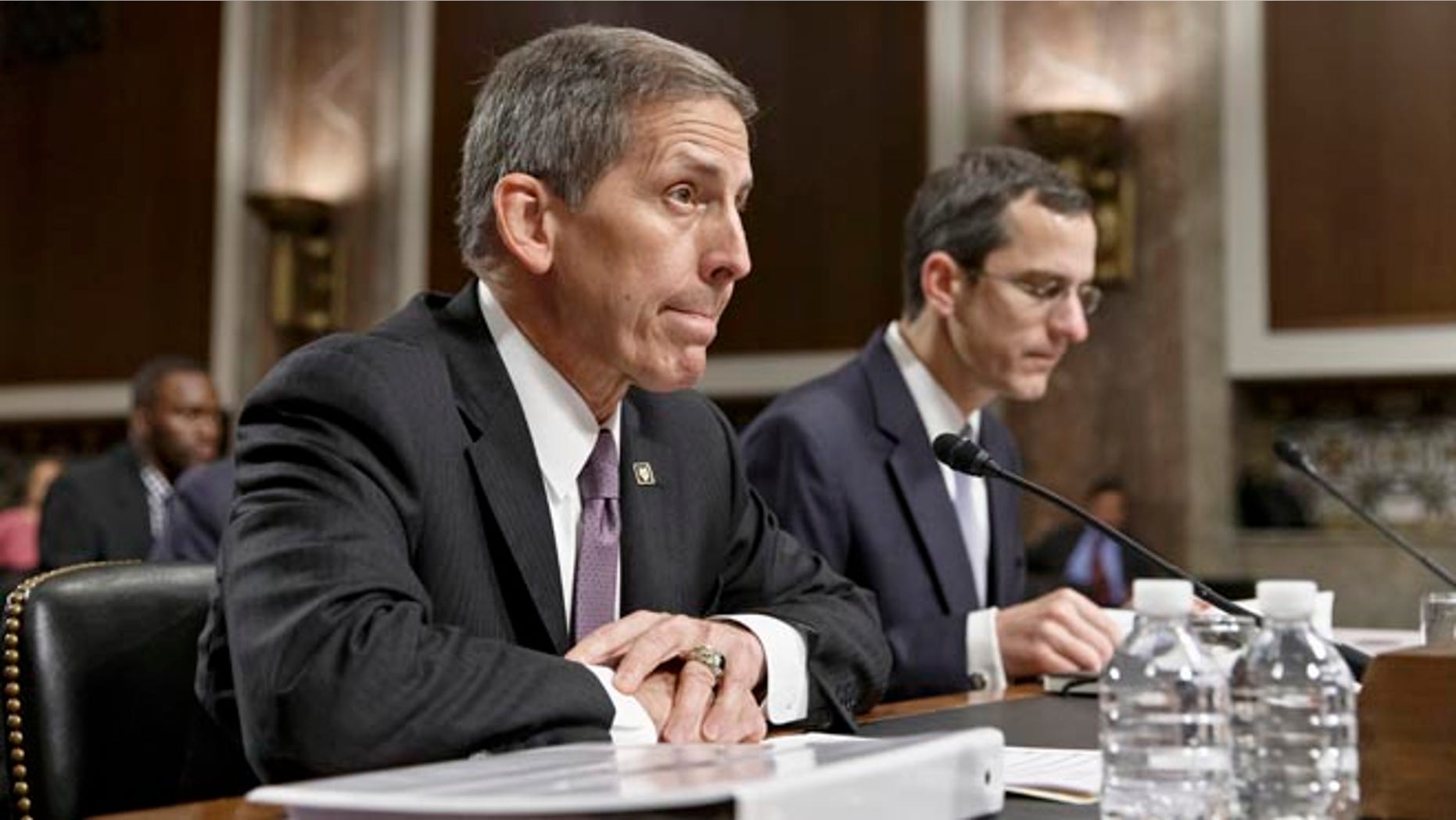 Veterans Affairs acting Secretary Sloan Gibson testifies on Capitol Hill in Washington, Wednesday, July 16, 2014, before the Senate Veterans' Affairs Committee hearing on the state of VA health care in the wake of revelations of neglect and delayed medical visits. He is accompanied by Assistant Deputy Undersecretary For Health For Administrative Operations Philip Matkowsky.