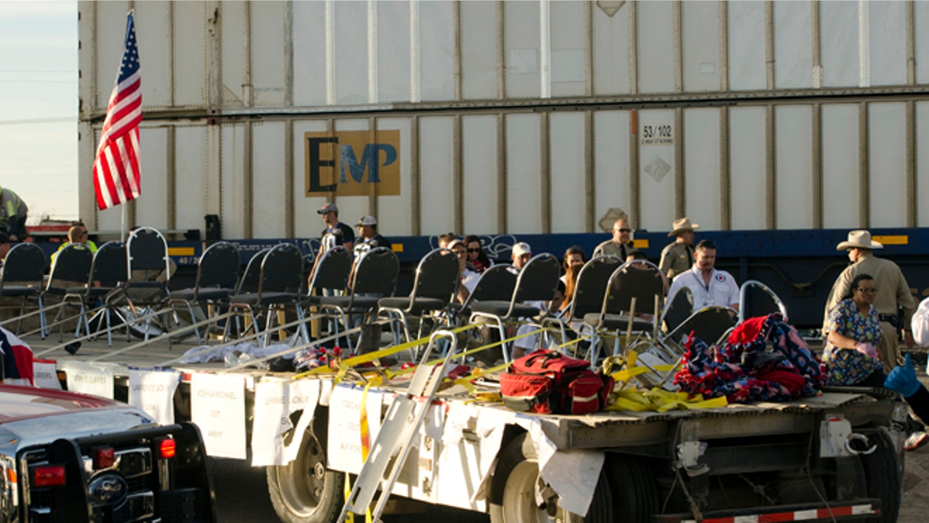 Nov. 15, 2012: In this file photo, authorities respond to an accident involving a trailer carrying wounded veterans that was struck by a train during a parade in Midland, Texas.