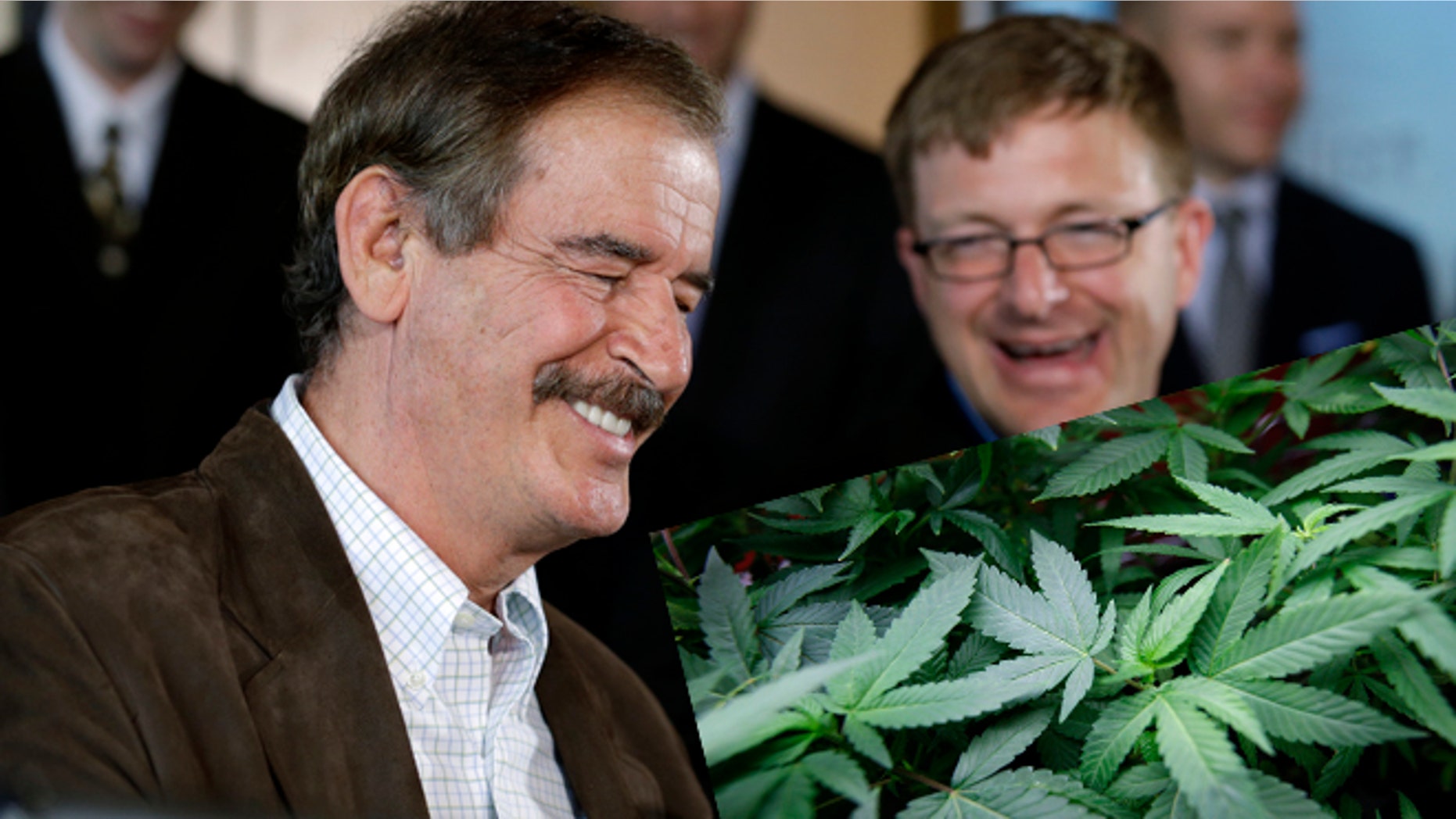 Former Mexican President Vicente Fox, left, speaks as Jamen Shively, CEO of Diego Pellicer, looks on during a news conference Thursday, May 30, 2013, in Seattle. (AP Photo/Elaine Thompson)