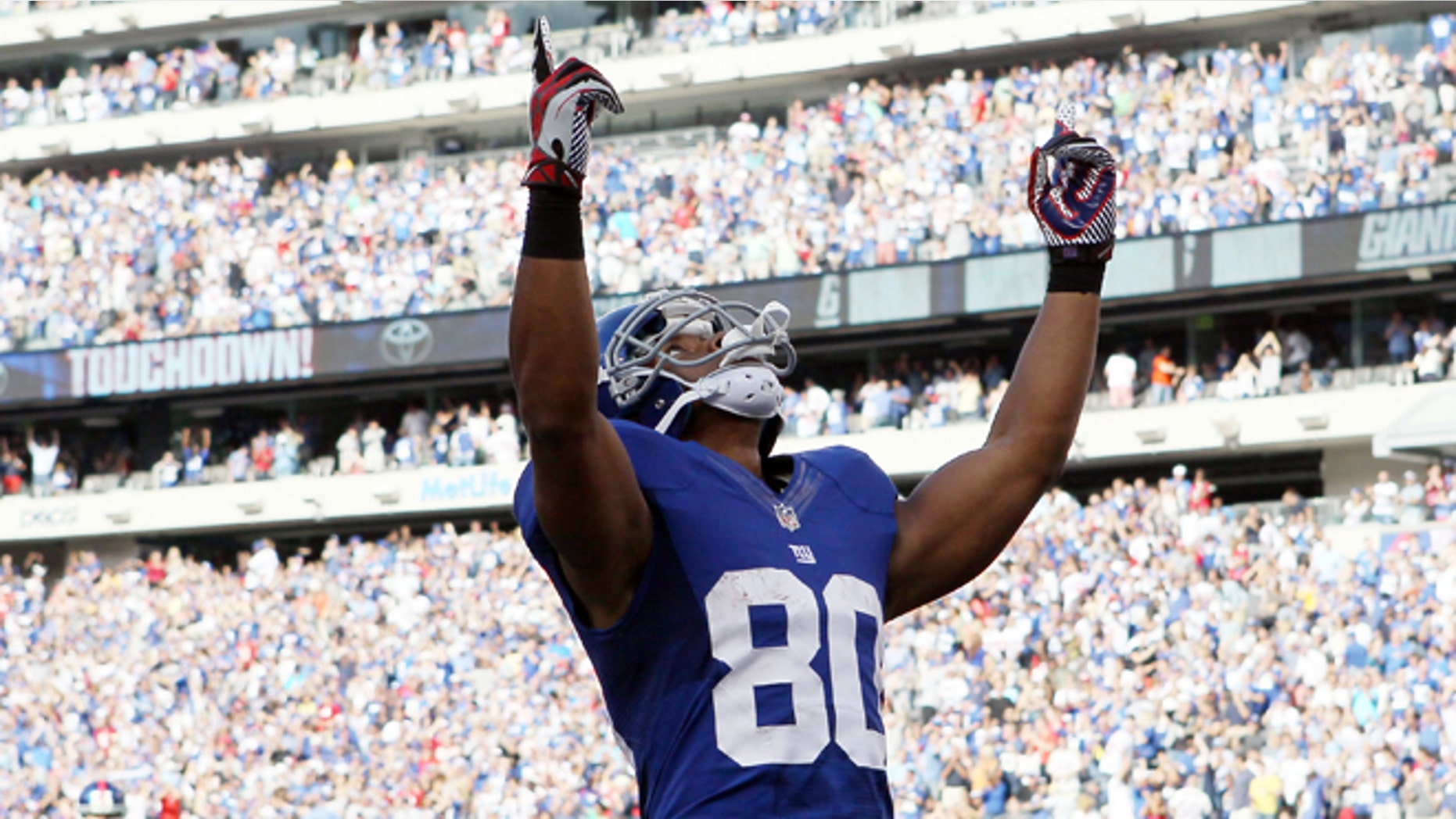 Victor Cruz #80 of the New York Giants celebrates a touchdown on September 16, 2012 at MetLife Stadium in East Rutherford, New Jersey.