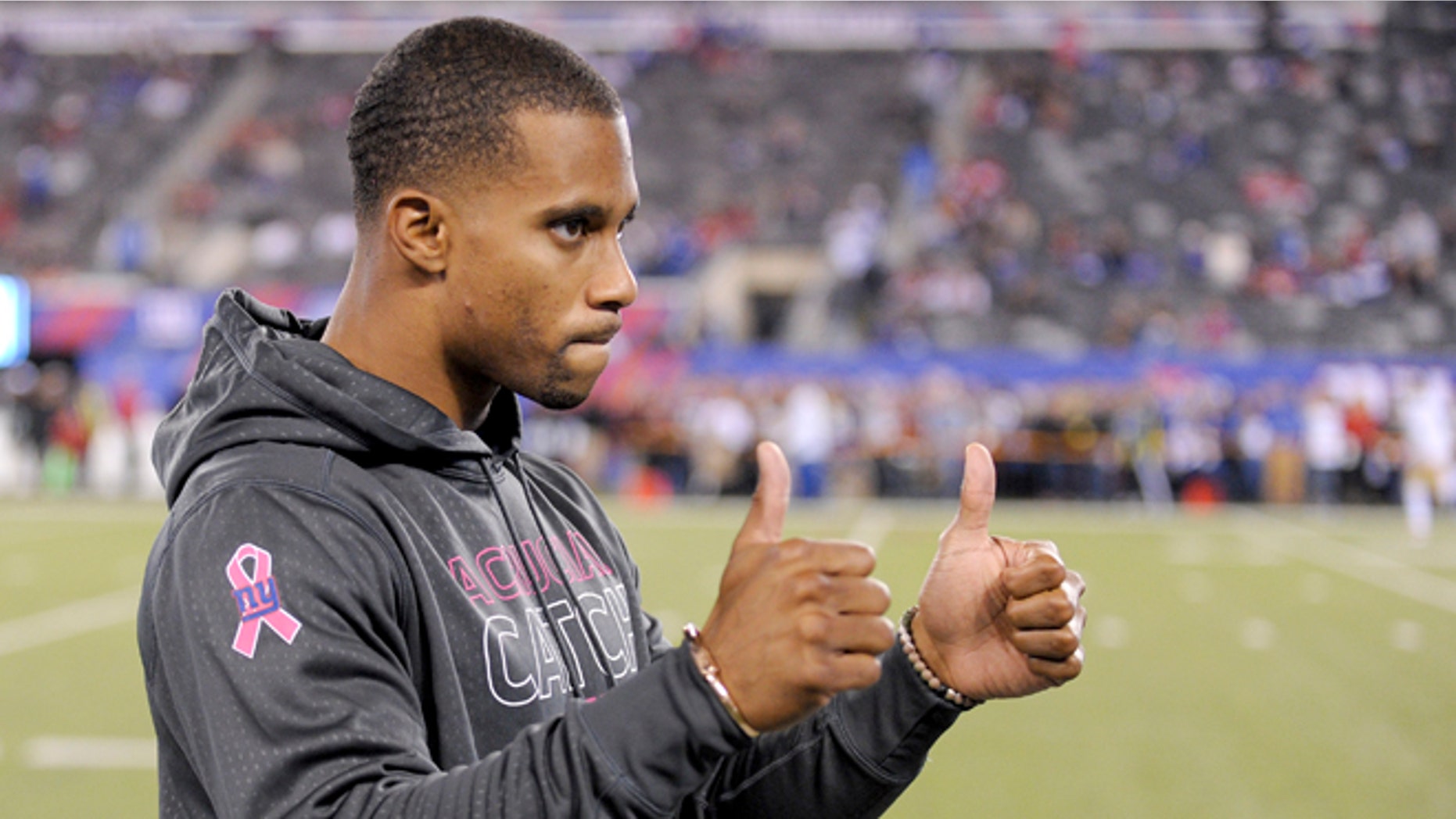 FILE - In this Oct. 11, 2015, file photo, New York Giants wide receiver Victor Cruz gestures on the sidelines before an NFL football game against the San Francisco 49ers in East Rutherford, N.J. Ben McAdoo's first season as Giants head coach could turn on the recoveries of two key players, Jason Pierre-Paul and Victor Cruz. (AP Photo/Bill Kostroun, File)