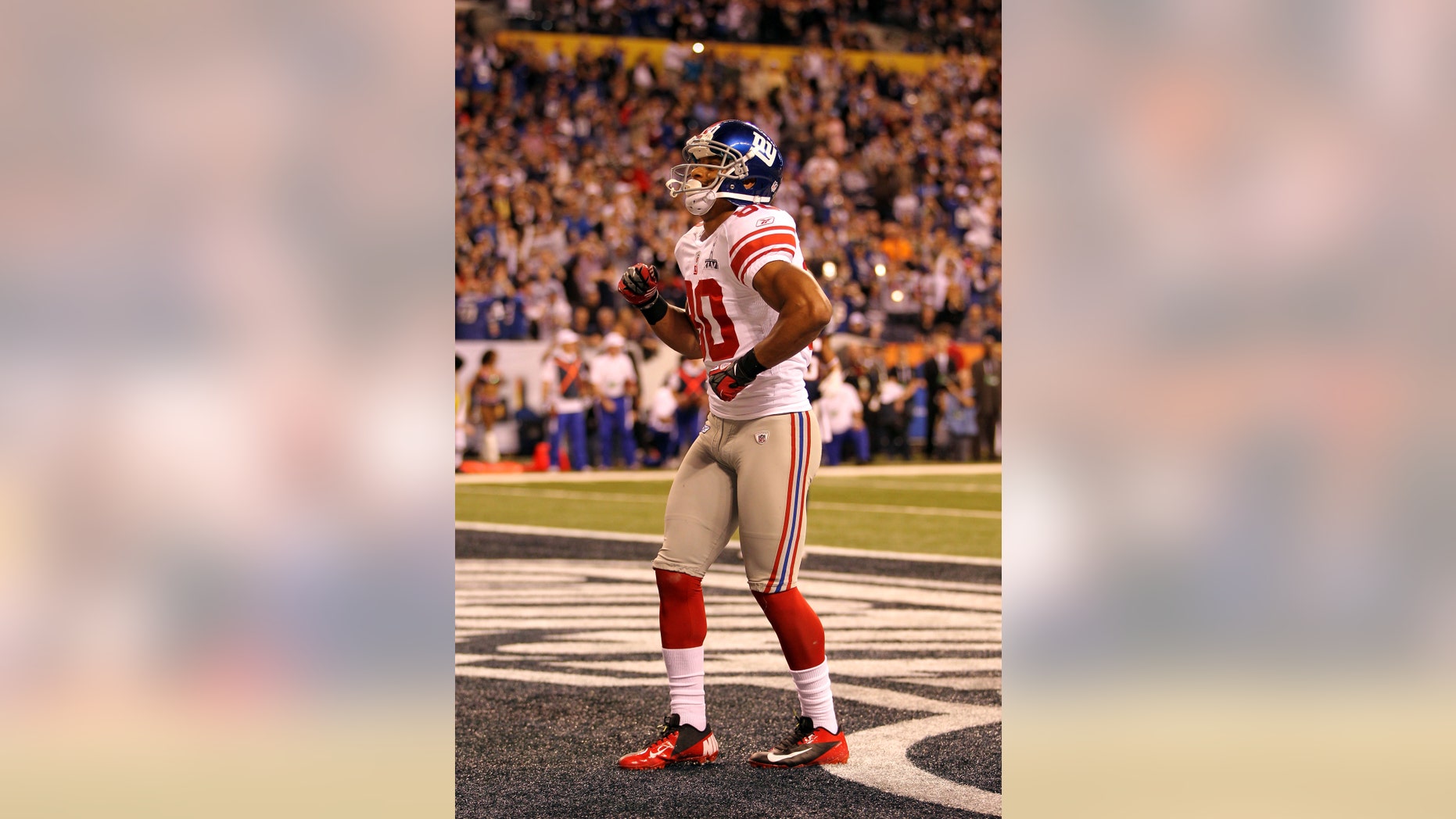 INDIANAPOLIS, IN - FEBRUARY 05: Victor Cruz #80 of the New York Giants celebrates in the end zone after catching a two yard touchdown pass from Eli Manning #10 in the first quarter against the New England Patriots during Super Bowl XLVI at Lucas Oil Stadium on February 5, 2012 in Indianapolis, Indiana. (Photo by Jamie Squire/Getty Images) *** Local Caption *** Victor Cruz