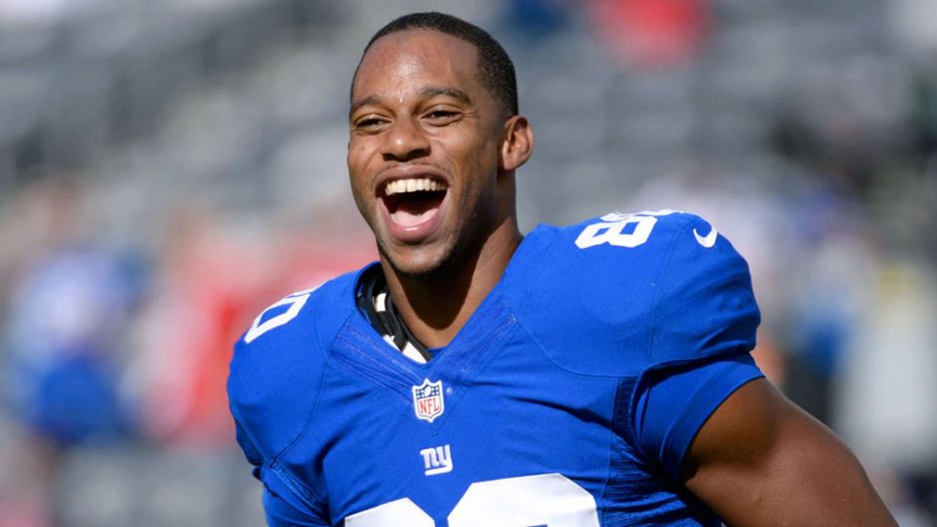 Sep 15, 2013; East Rutherford, NJ, USA; New York Giants wide receiver Victor Cruz (80) smiles before the game against the Denver Broncos at MetLife Stadium. Mandatory Credit: Robert Deutsch-USA TODAY Sports