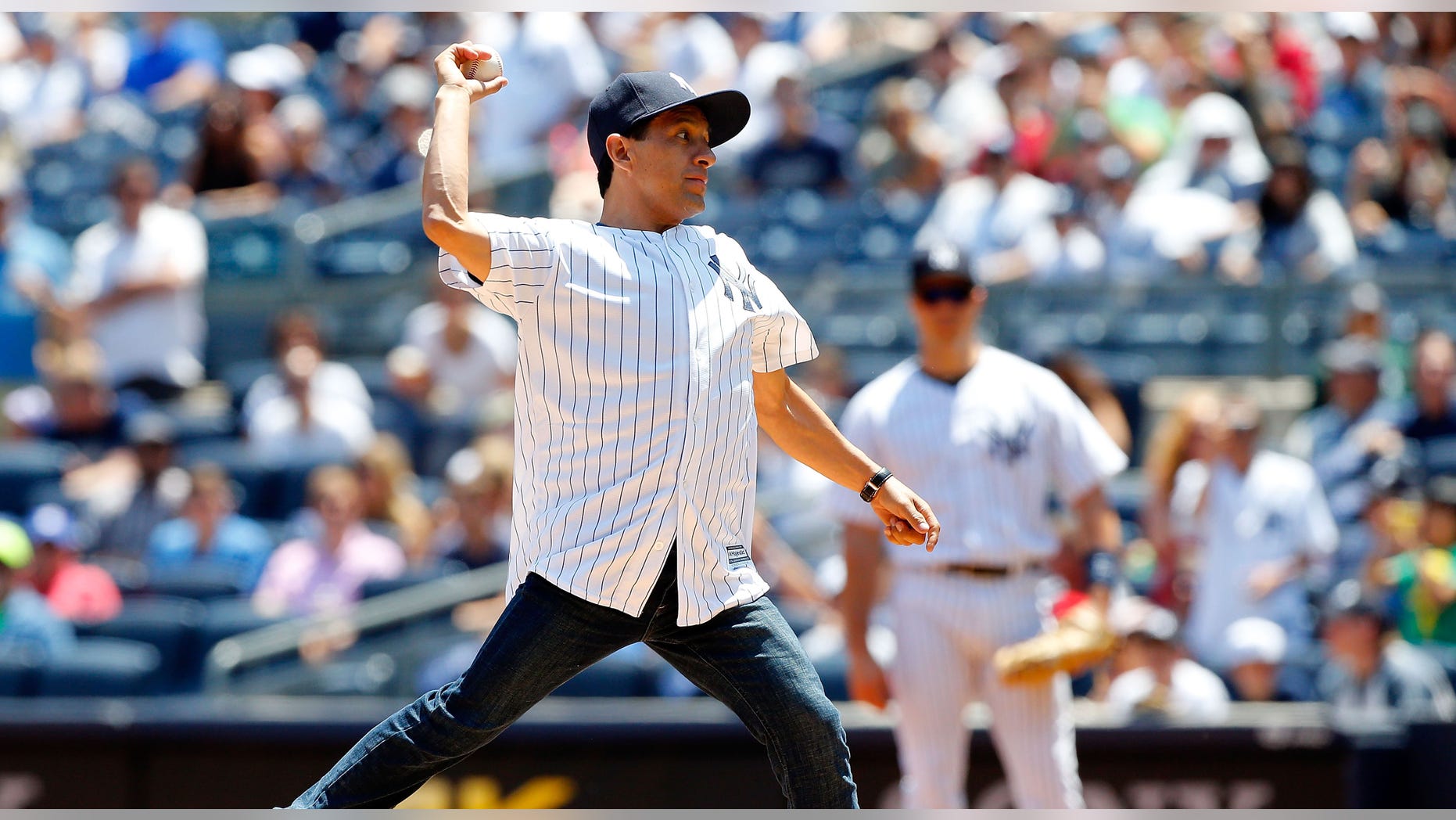 NEW YORK, NY - JUNE 07: Horse racing 2015 Triple Crown winner as jockey of American Pharoah Victor Espinoza throws the ceremonial first pitch of a game between the New York Yankees and the Los Angeles Angels of Anaheim at Yankee Stadium on June 7, 2015 in the Bronx borough of New York City. (Photo by Jim McIsaac/Getty Images)